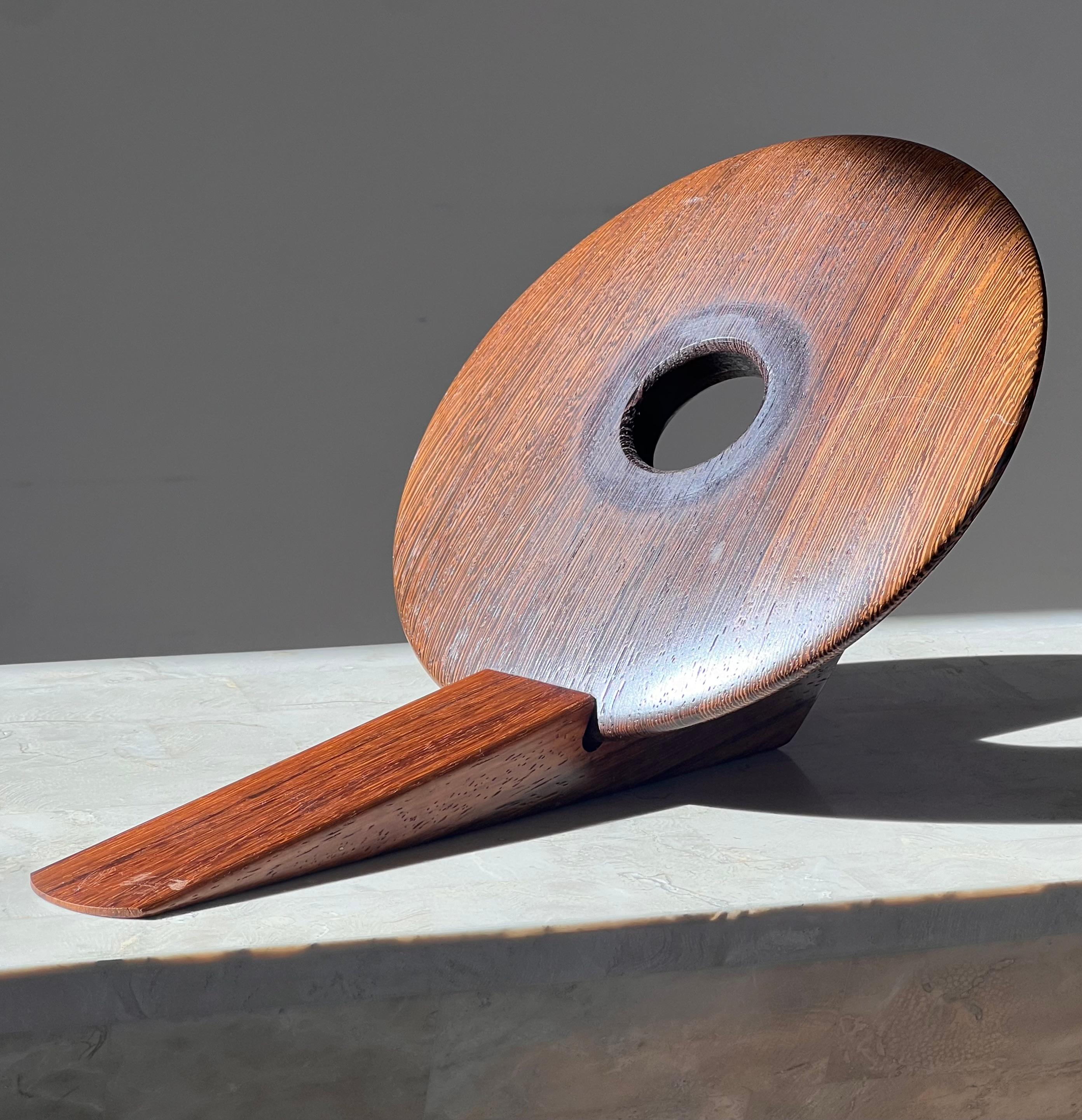 An artist-made Danish mid century teak wine holder, signed, mid 20th century 8
