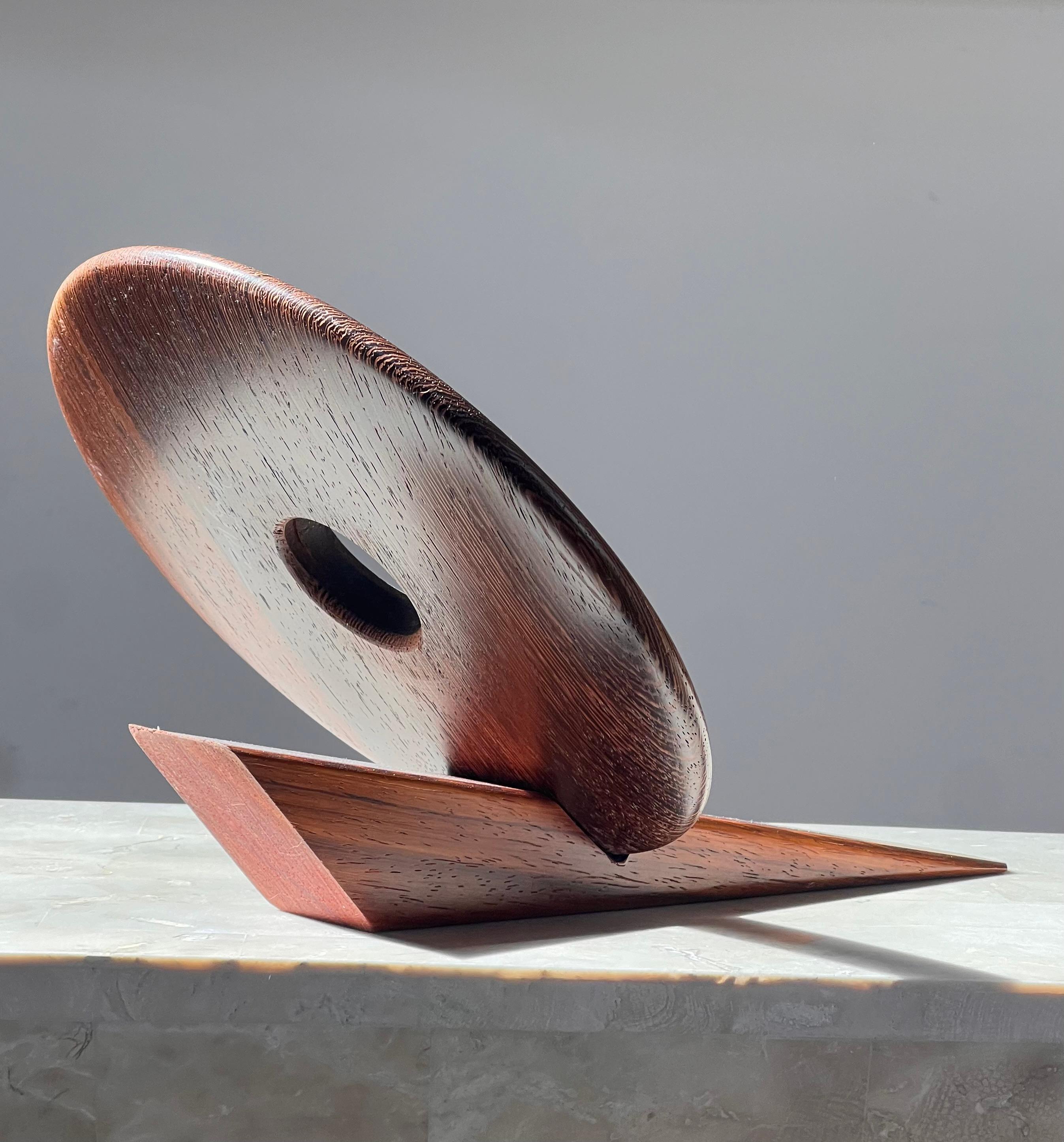 An artist-made Danish mid century teak wine holder, signed, mid 20th century 12