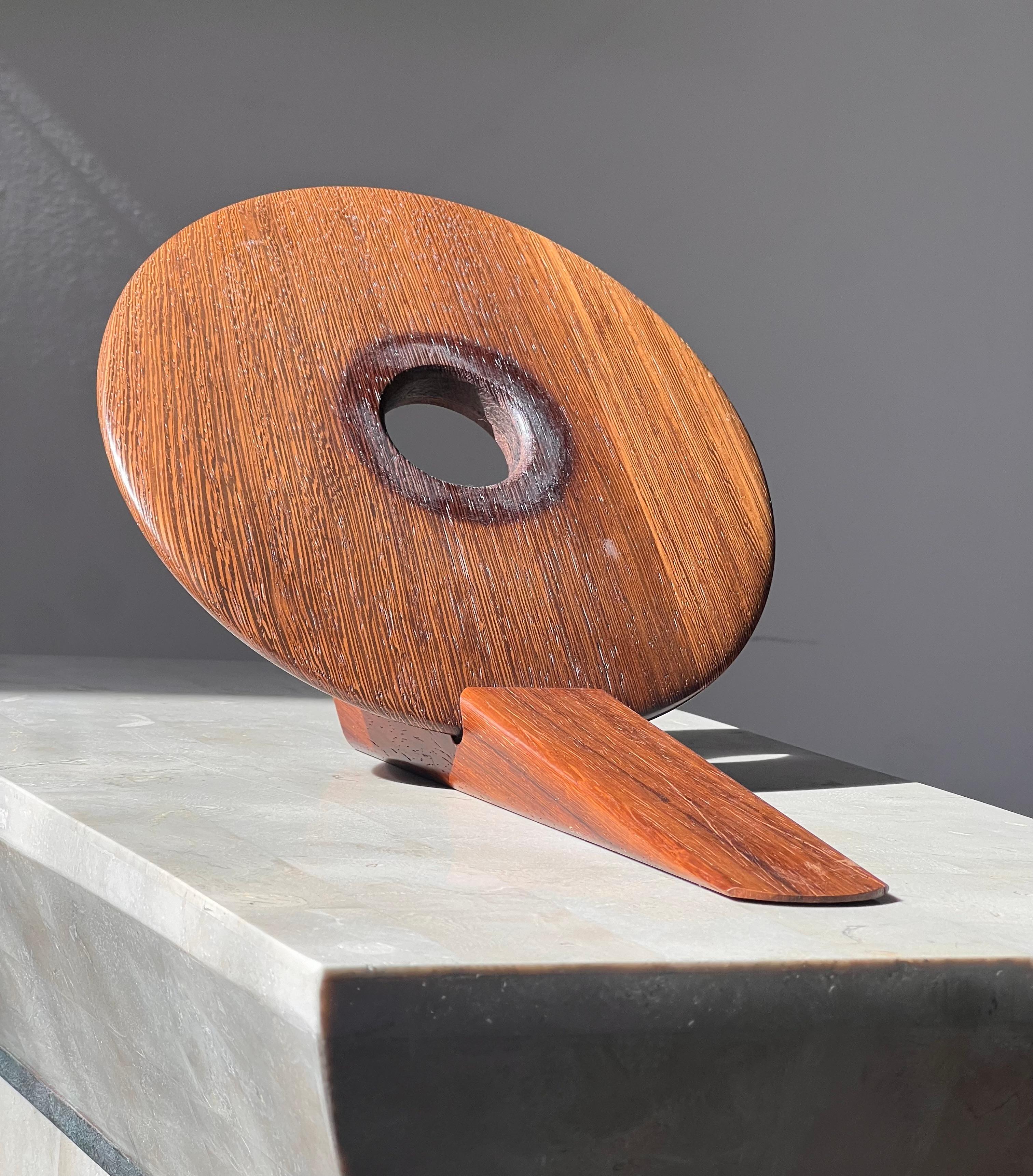A Danish mid century wine bottle holder, signed by artist, circa 1960. In teak, of course. Pick up in central west Los Angeles or we ship worldwide. 
8.75” W x 13” D x 7” H