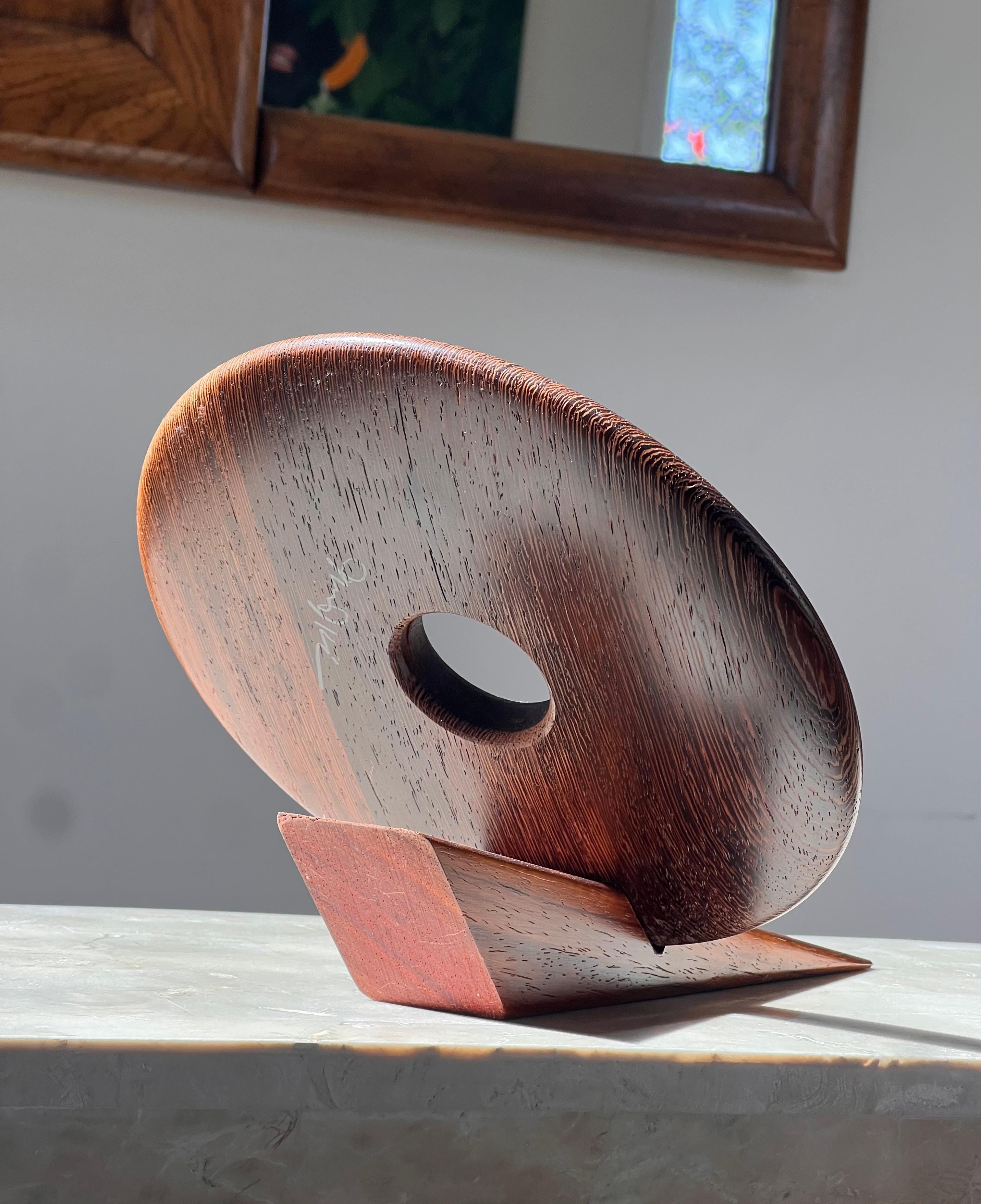 Teak An artist-made Danish mid century teak wine holder, signed, mid 20th century