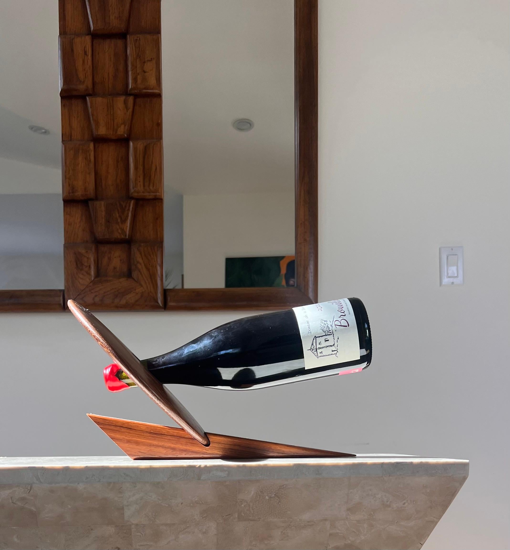 An artist-made Danish mid century teak wine holder, signed, mid 20th century 2