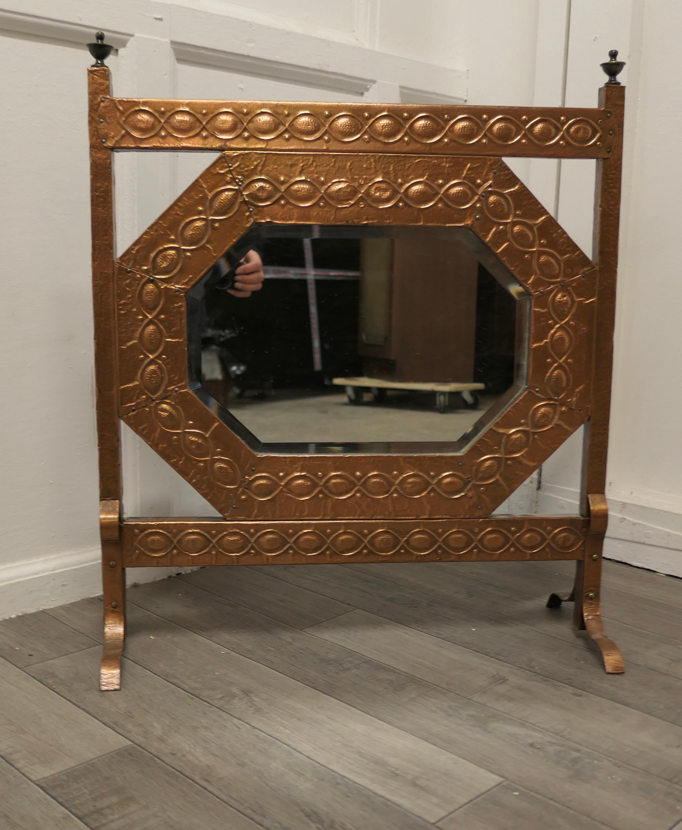 An arts and crafts beaten copper mirror fire screen


This is a most charming fire screen it has at the centre an Octagonal bevelled mirror and this is set in a beaten copper frame
The screen is good quality and made in copper and lined in metal