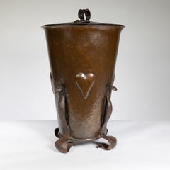 An Arts and Crafts brass coal bucket