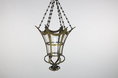 An Arts and Crafts brass conical shaped lantern with its original conical shade