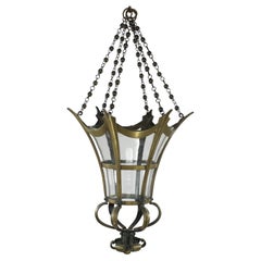 An Arts and Crafts brass conical shaped lantern with its original conical shade