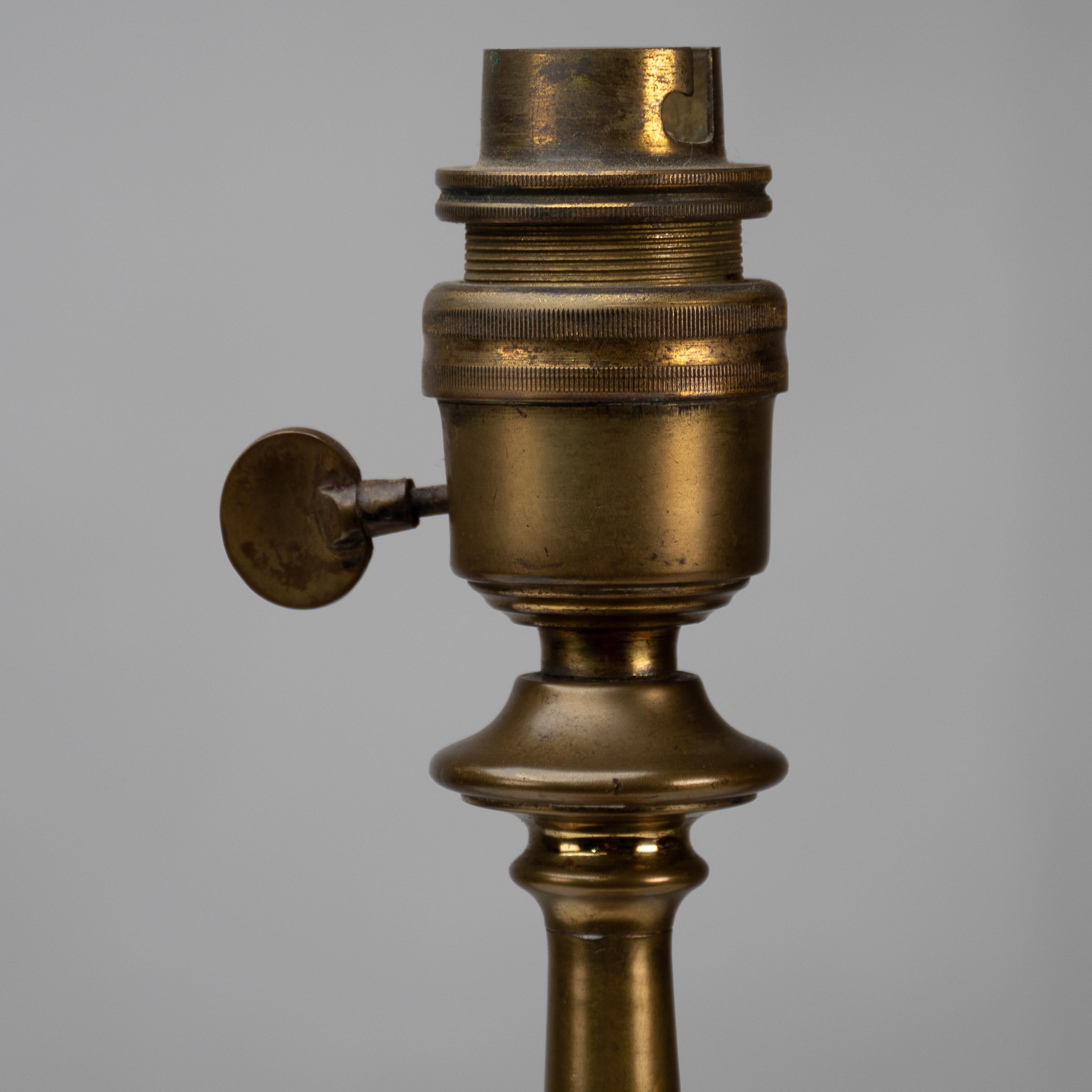 An Arts and Crafts brass table lamp in the style of C F A Voysey For Sale 4