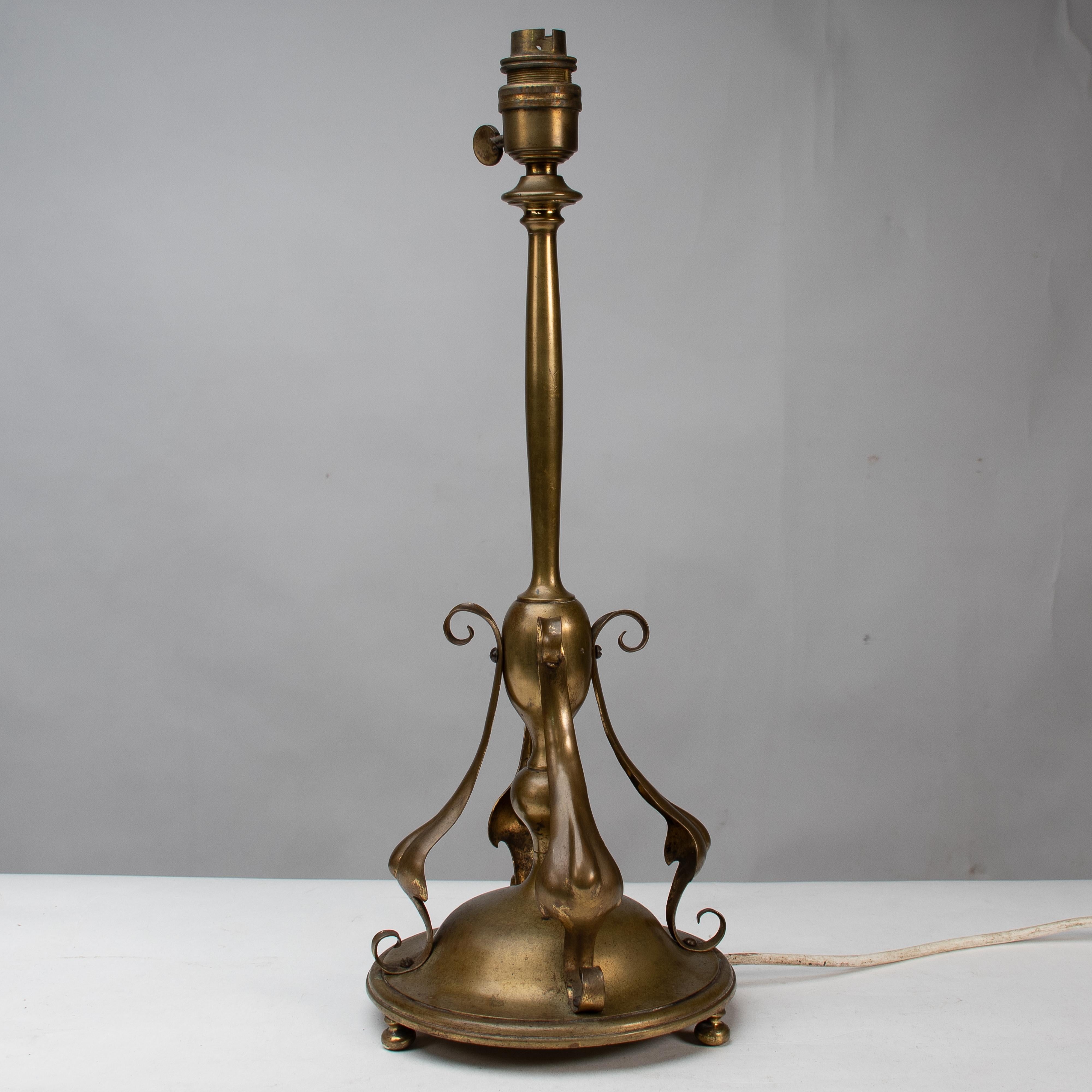 Brass An Arts and Crafts brass table lamp in the style of C F A Voysey For Sale