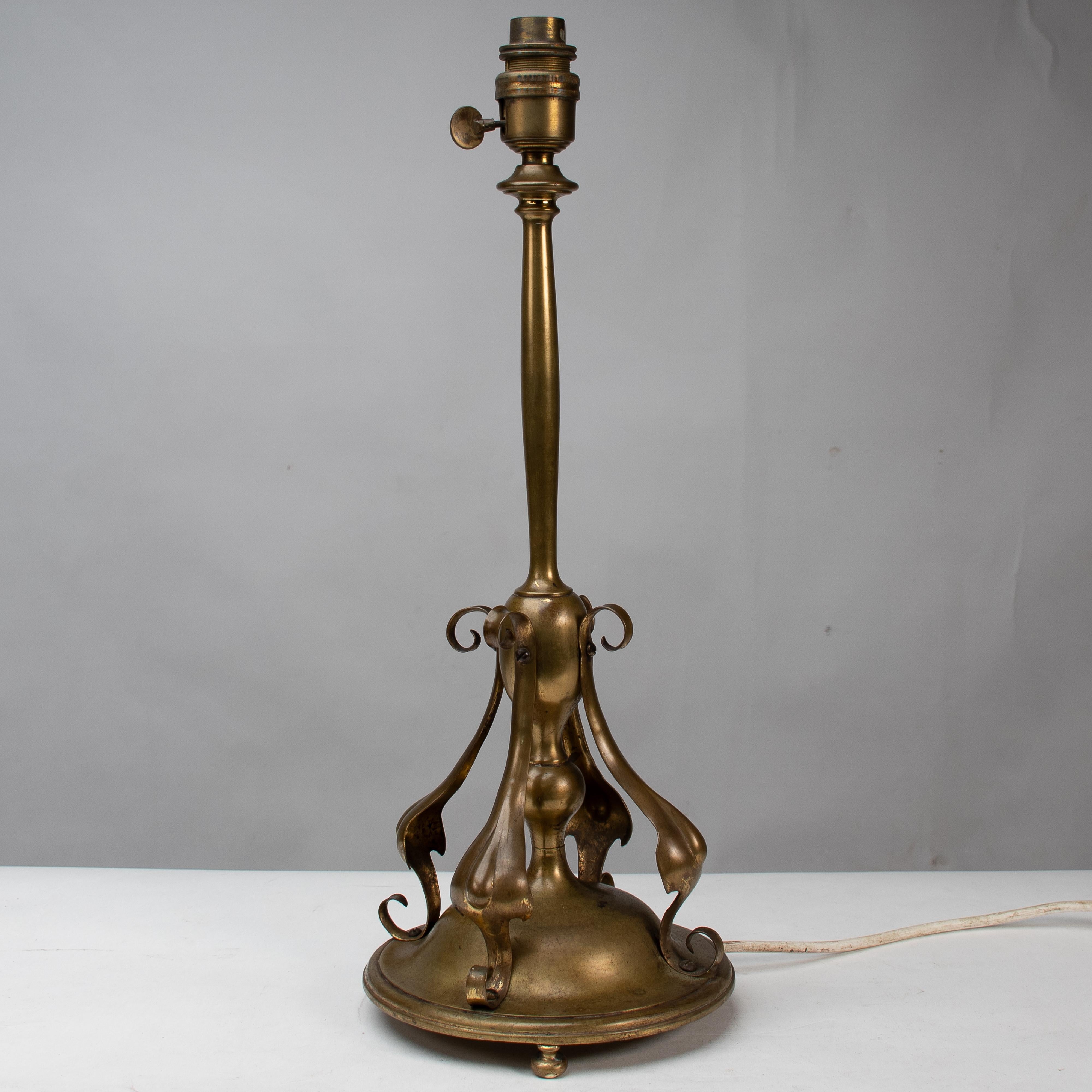 An Arts and Crafts brass table lamp in the style of C F A Voysey For Sale 2