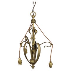 Antique An Arts and Crafts brass three arm ceiling light