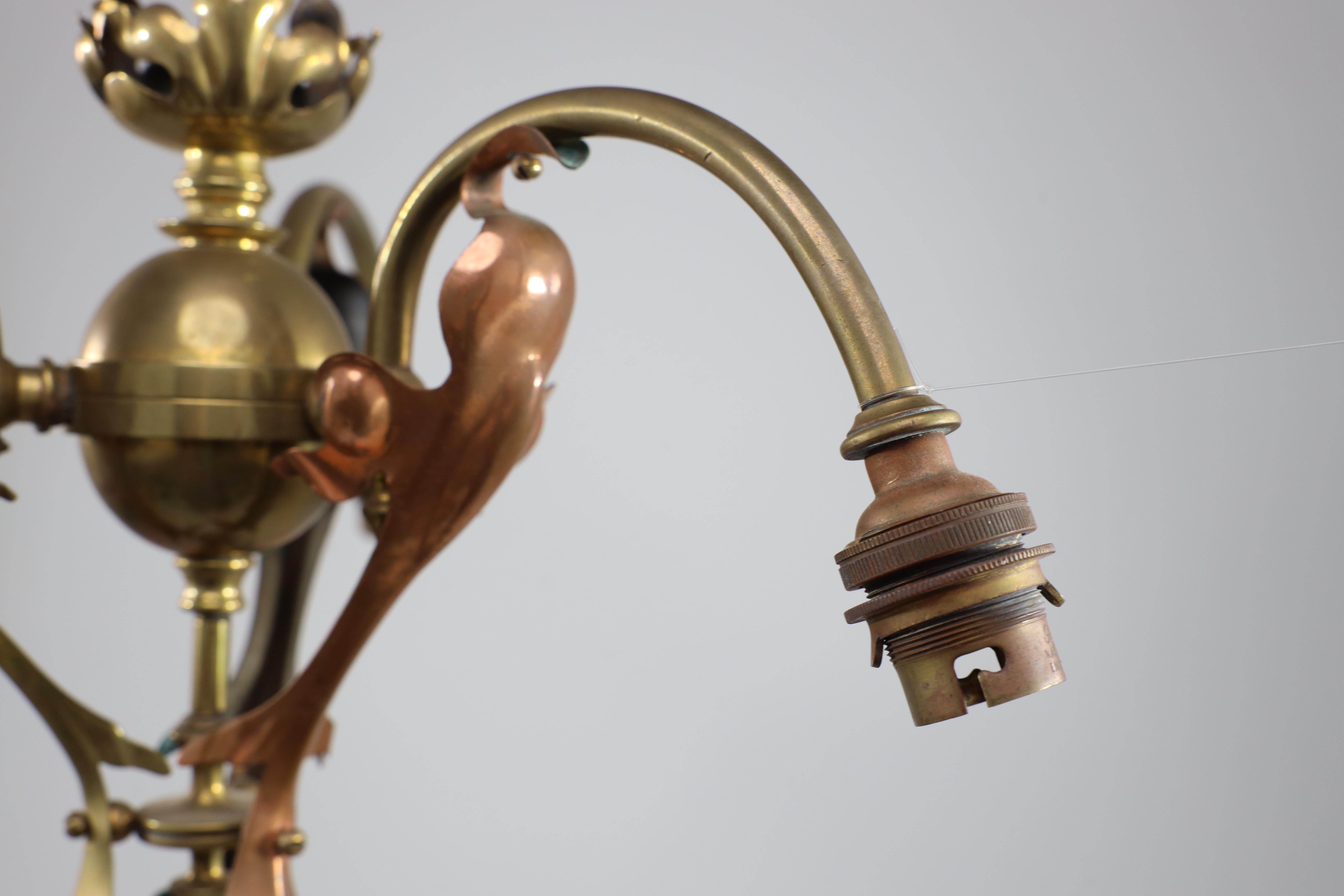 An Arts and Crafts brass three arm ceiling light with a flower bud to the top For Sale 4