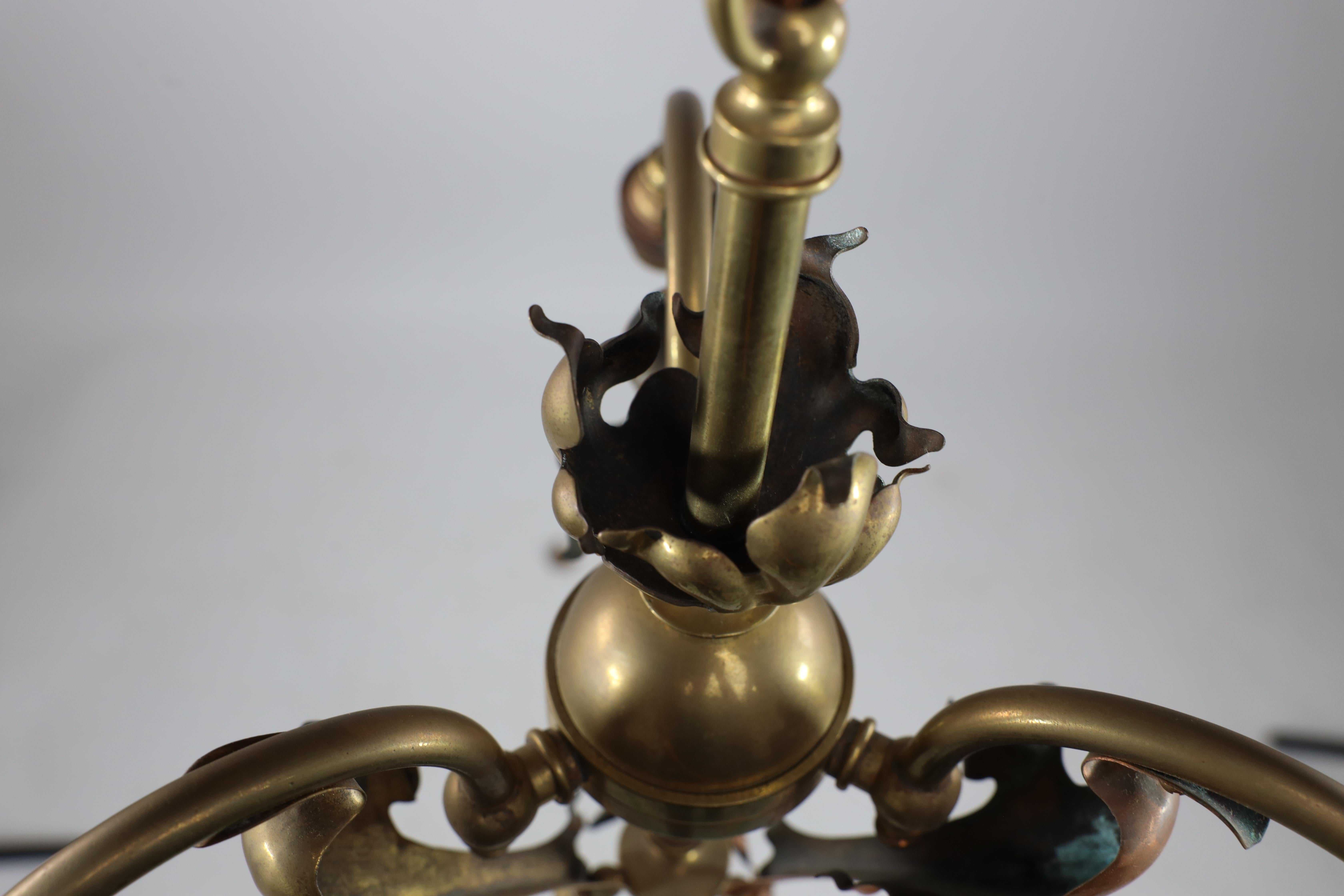 Brass An Arts and Crafts brass three arm ceiling light with a flower bud to the top For Sale
