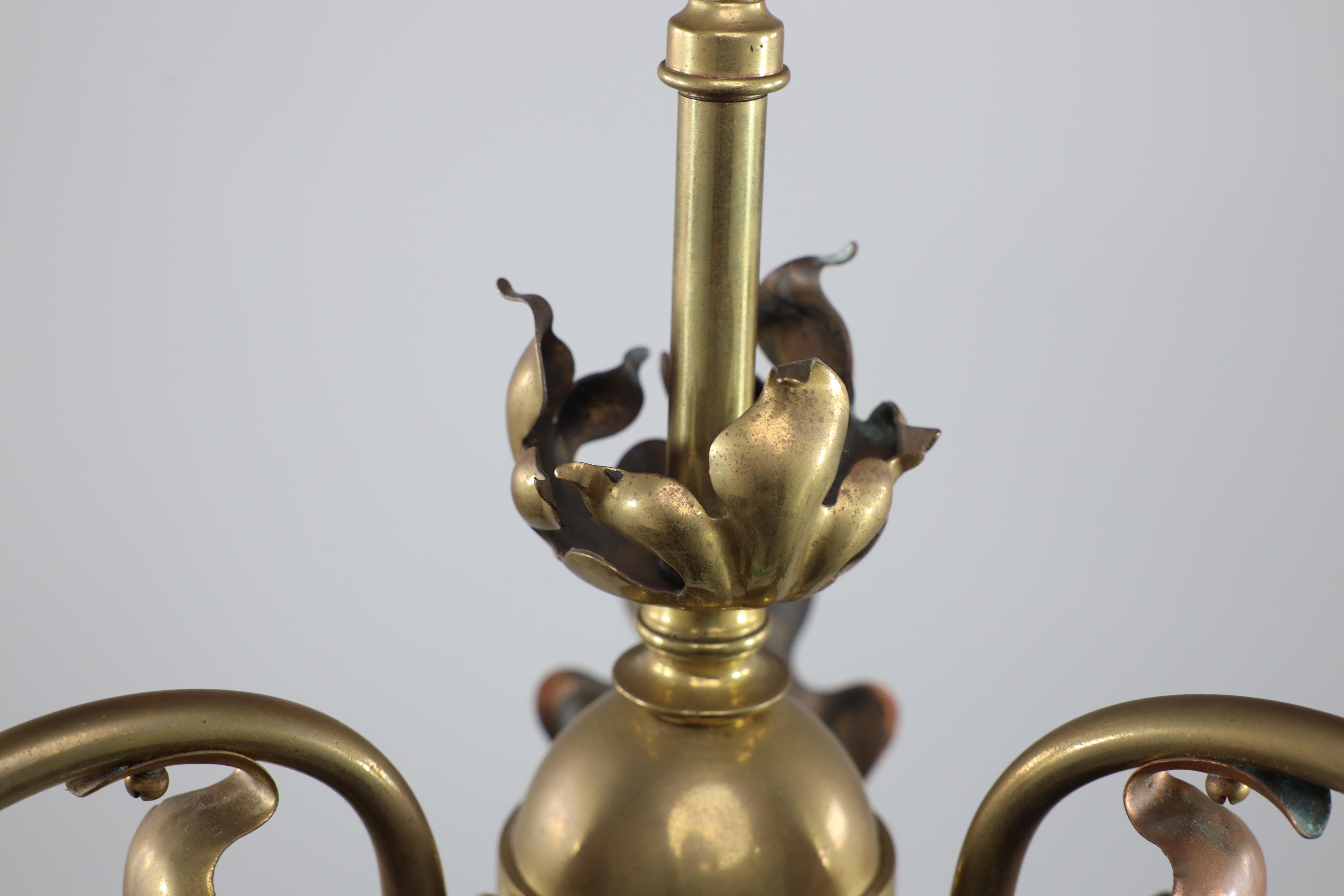 An Arts and Crafts brass three arm ceiling light with a flower bud to the top For Sale 1