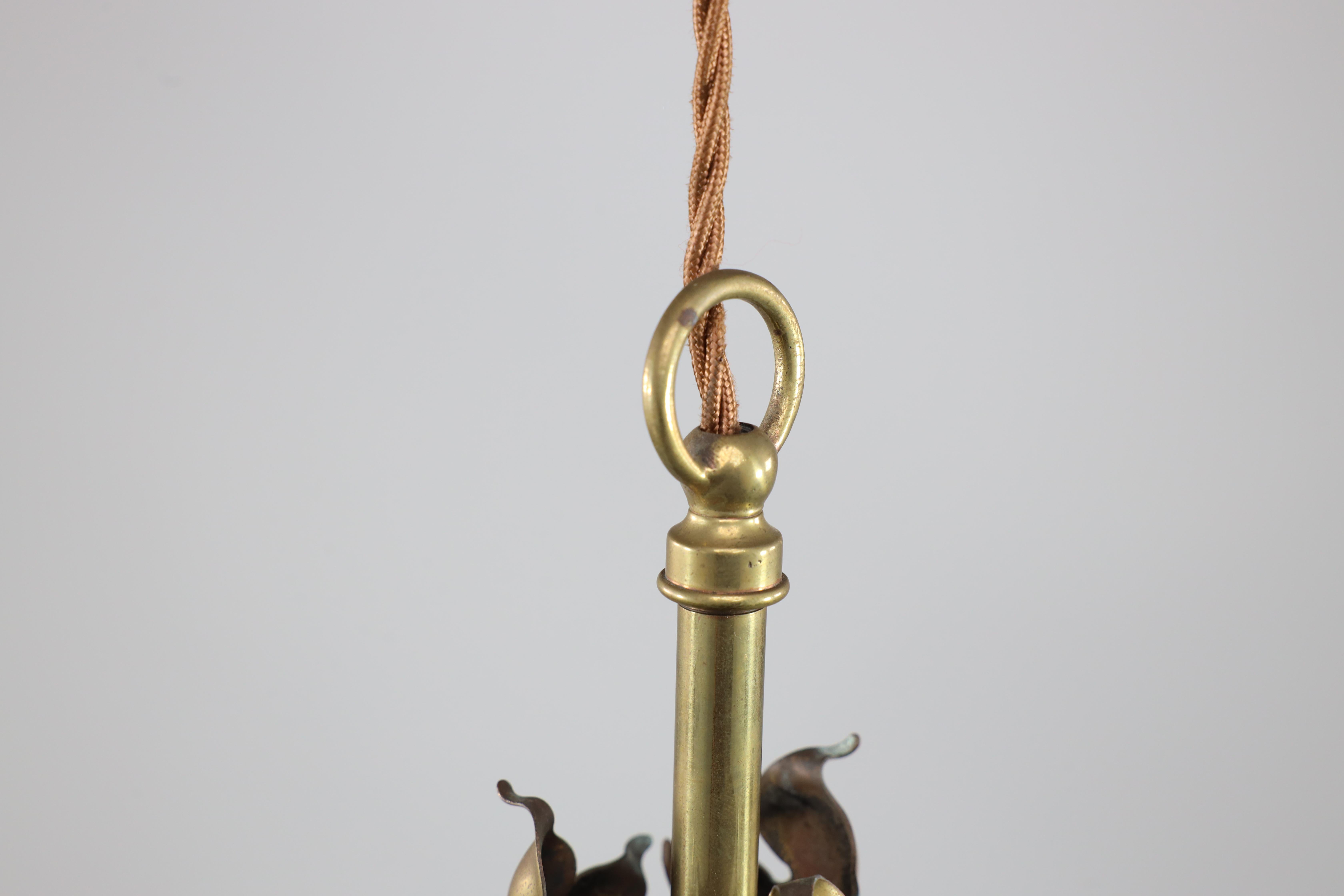 Early 20th Century An Arts and Crafts brass three arm ceiling light with a flower bud to the top For Sale