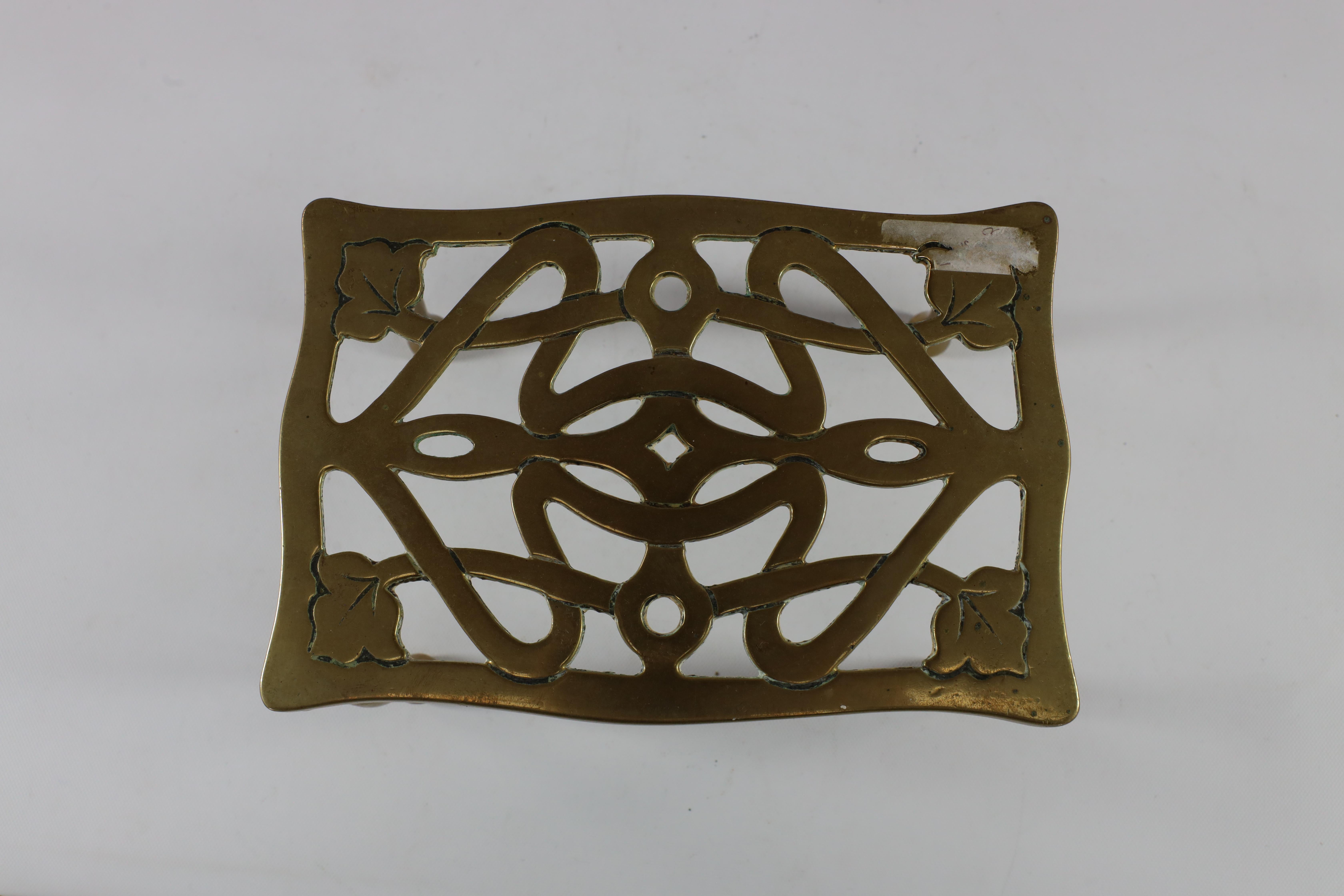 An Arts and Crafts brass trivet with pierced floral decoration to the top For Sale 5