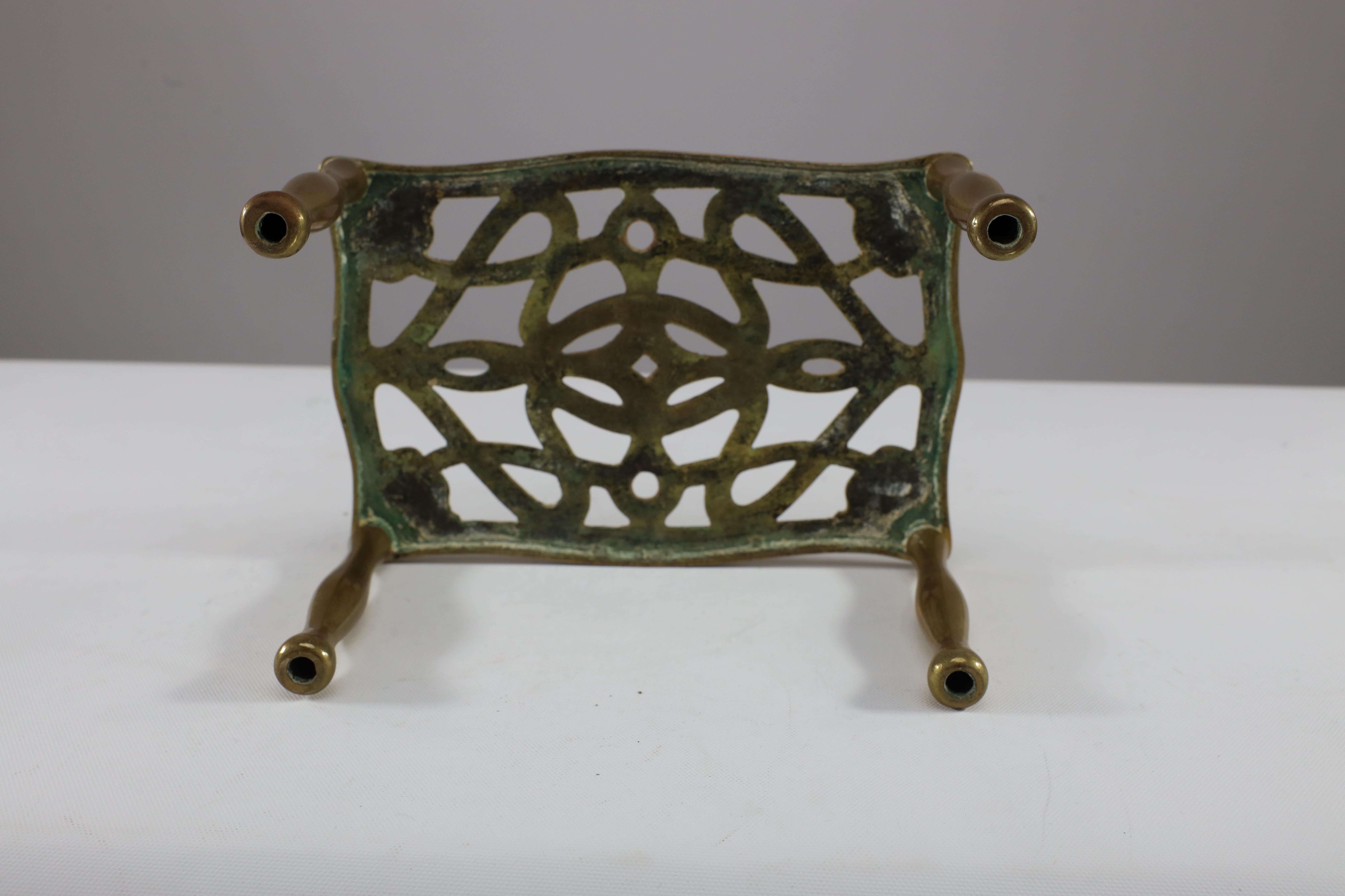 An Arts and Crafts brass trivet with pierced floral decoration to the top For Sale 9