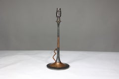 An Arts and Crafts copper table lamp professionally rewired