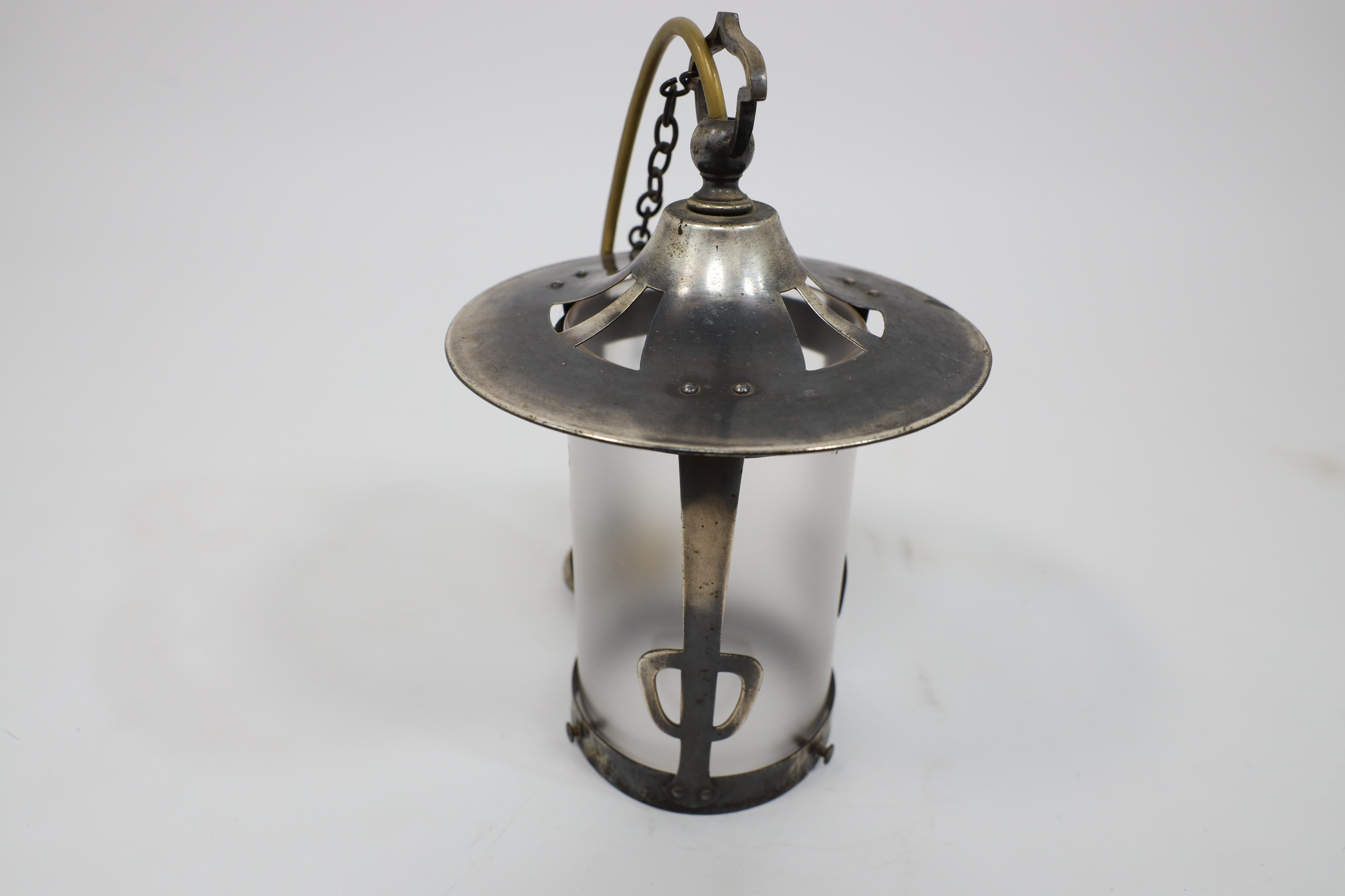 An Arts and Crafts Glasgow School hand hammered copper lantern with flaring top. In Good Condition For Sale In London, GB