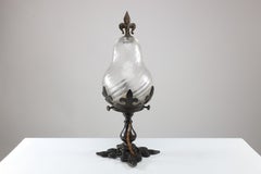 An Arts and Crafts/Gothic patinated bronze ceiling light