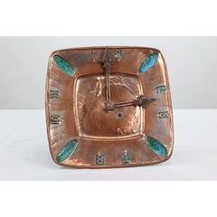 An Arts and Crafts hand formed copper and turquoise blue enamel wall clock