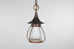 An Arts and Crafts little copper lantern with the original bulbous shade.