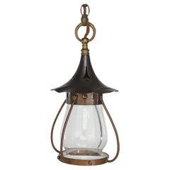 An Arts and Crafts little copper lantern with the original bulbous shade.
