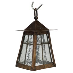 An Arts and Crafts little copper lantern with the original opaque shade