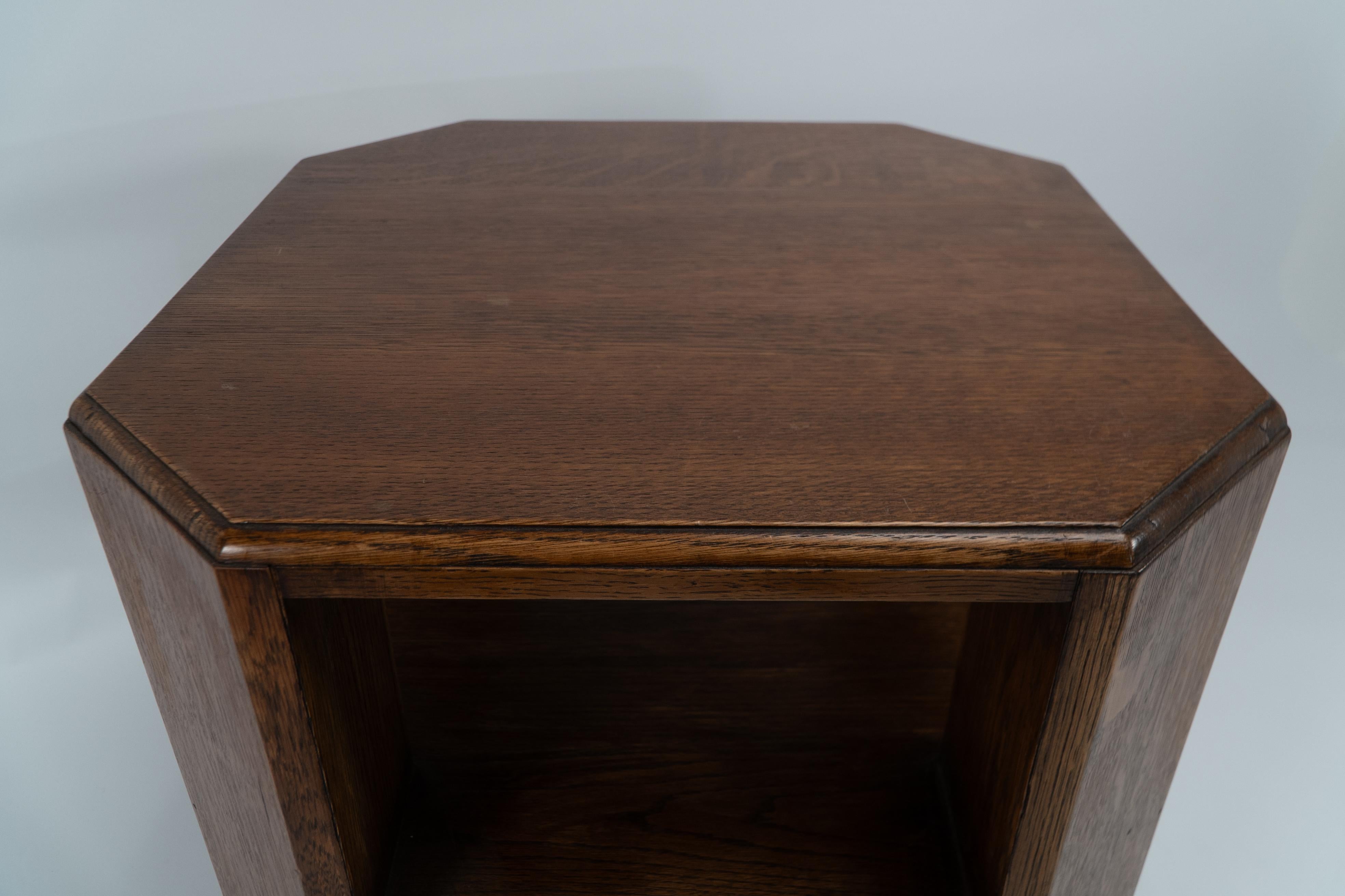 Heals. Arts & Crafts oak octagonal coffee or side table with lower book shelves. In Good Condition In London, GB
