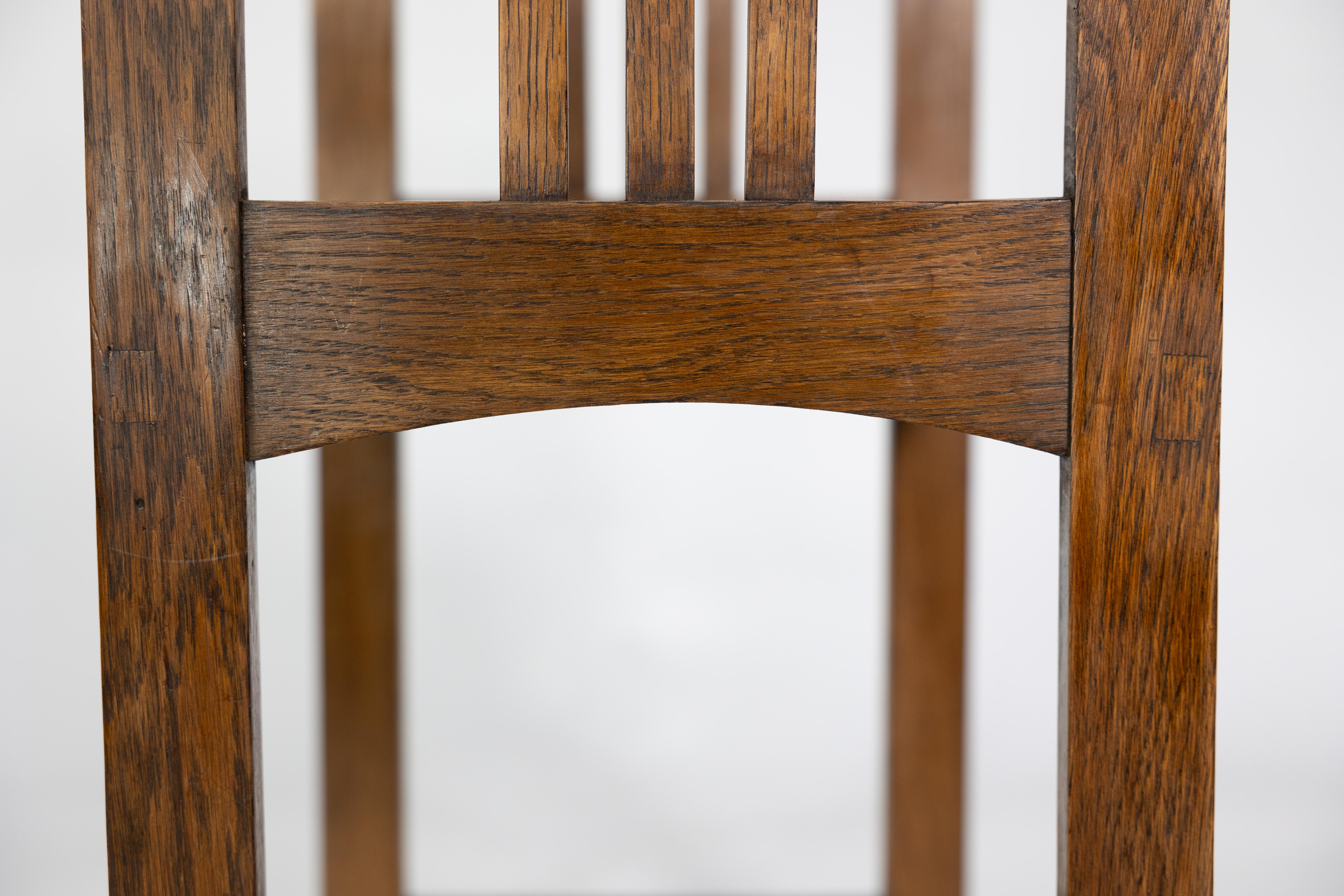 An Arts and Crafts oak piano stool with raised sides 8