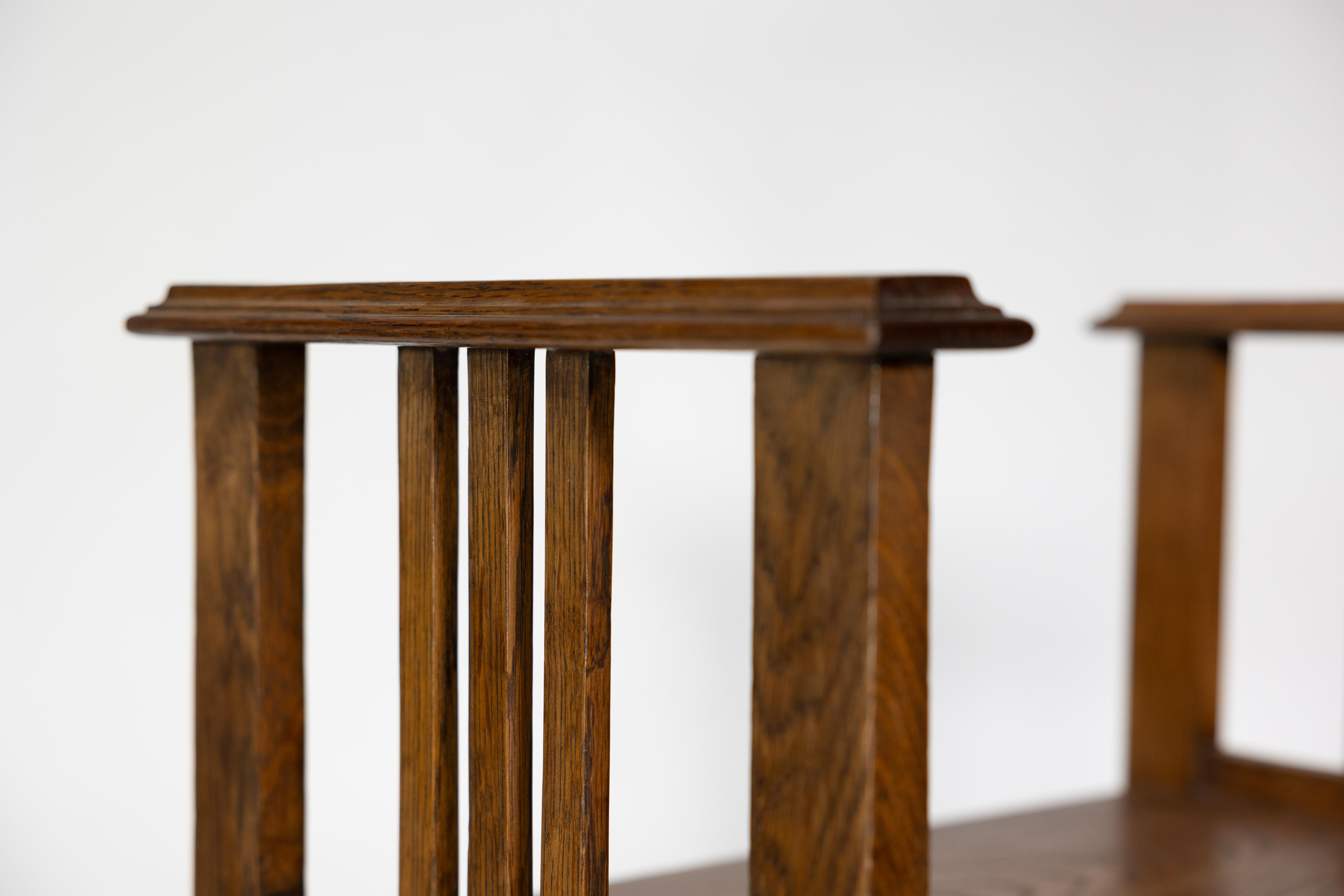 An Arts and Crafts oak piano stool with raised sides 9