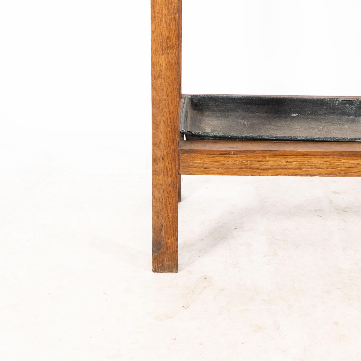 An Arts and Crafts oak stick and umbrella stand with fourteen sections For Sale 6