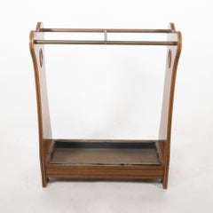 An Arts and Crafts oak umbrella and walking stick stand