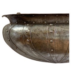 An Arts and Crafts Polished Steel Wall Planter