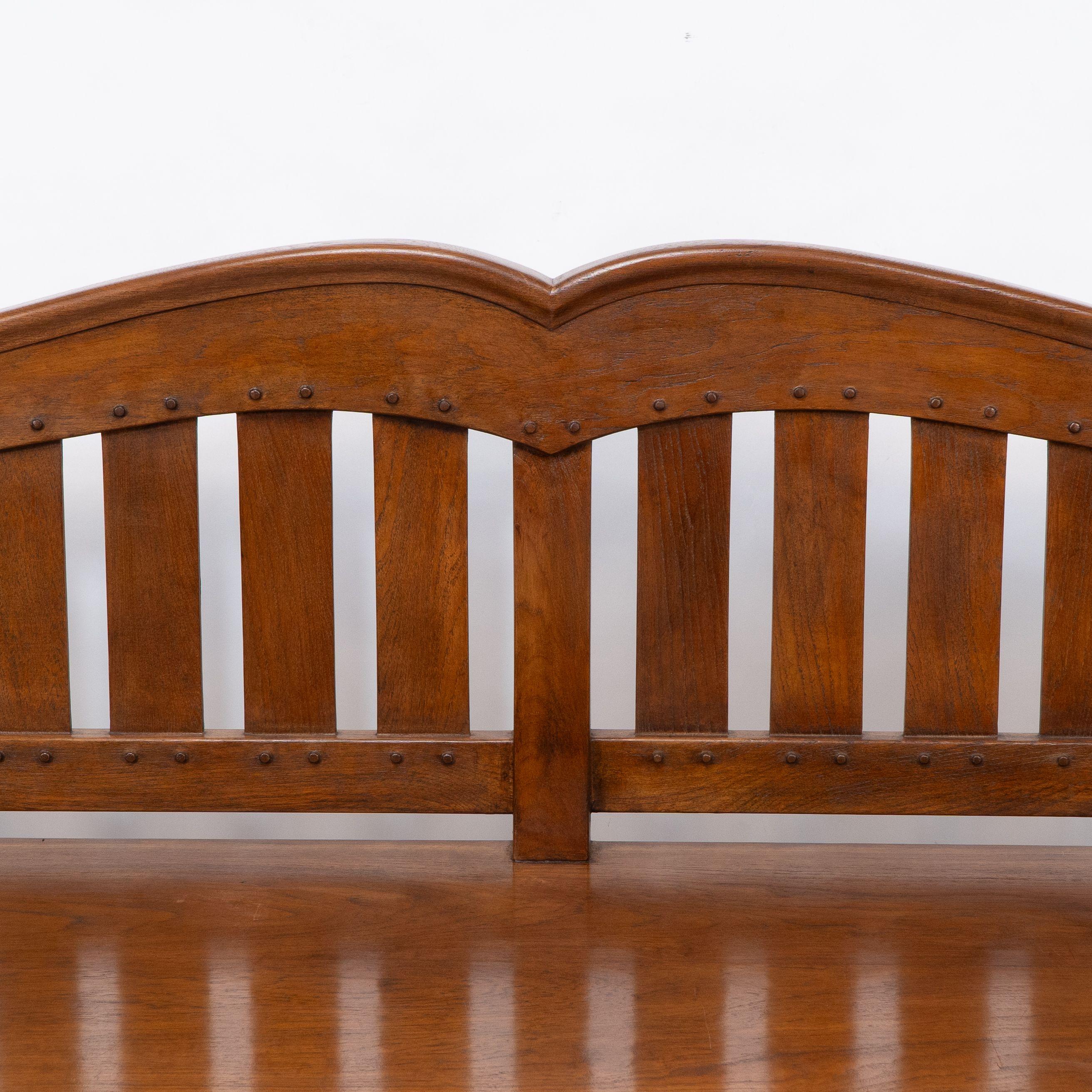 Early 20th Century An Arts and Crafts super quality teak hall bench in the style of Arthur Simpson For Sale