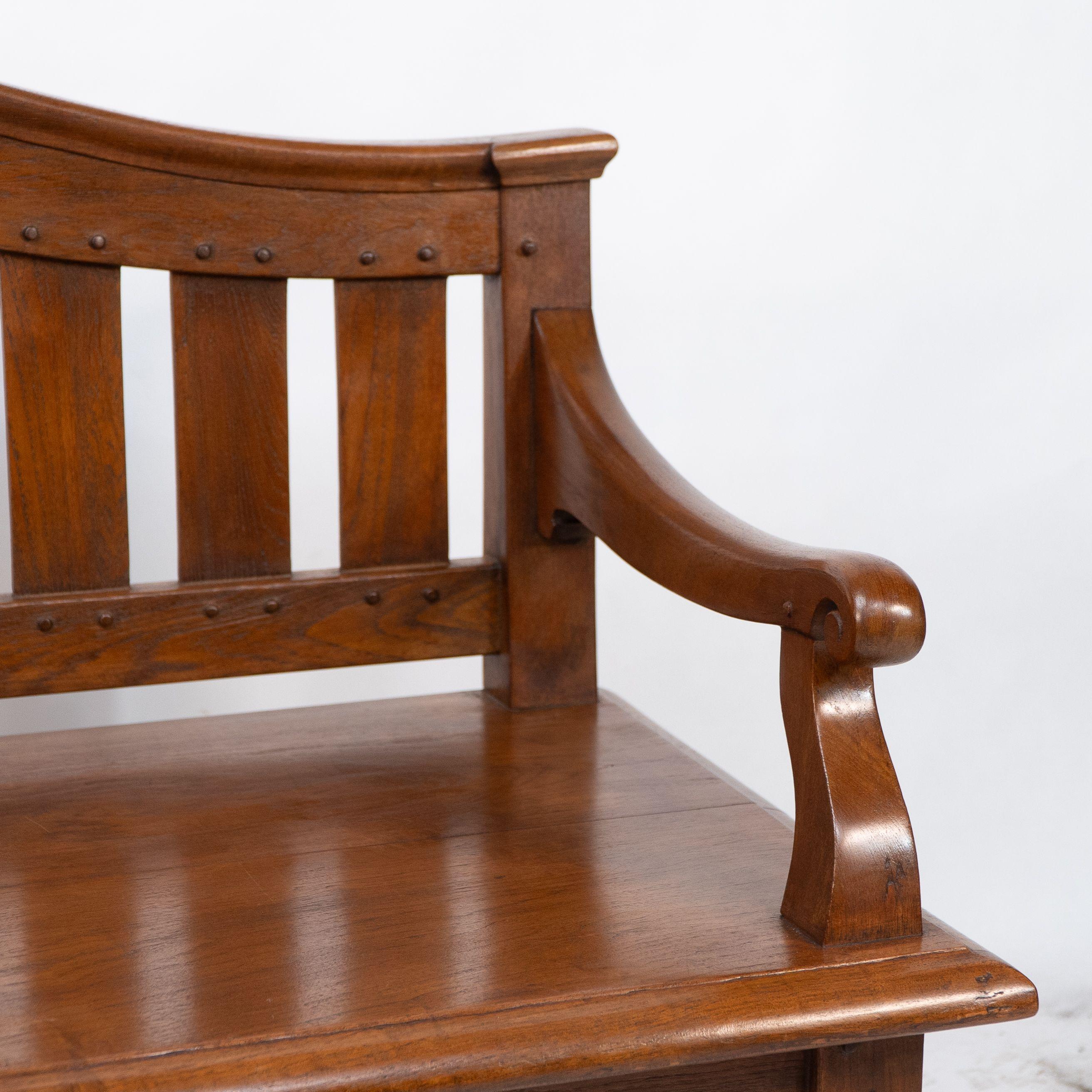 An Arts and Crafts super quality teak hall bench in the style of Arthur Simpson For Sale 1