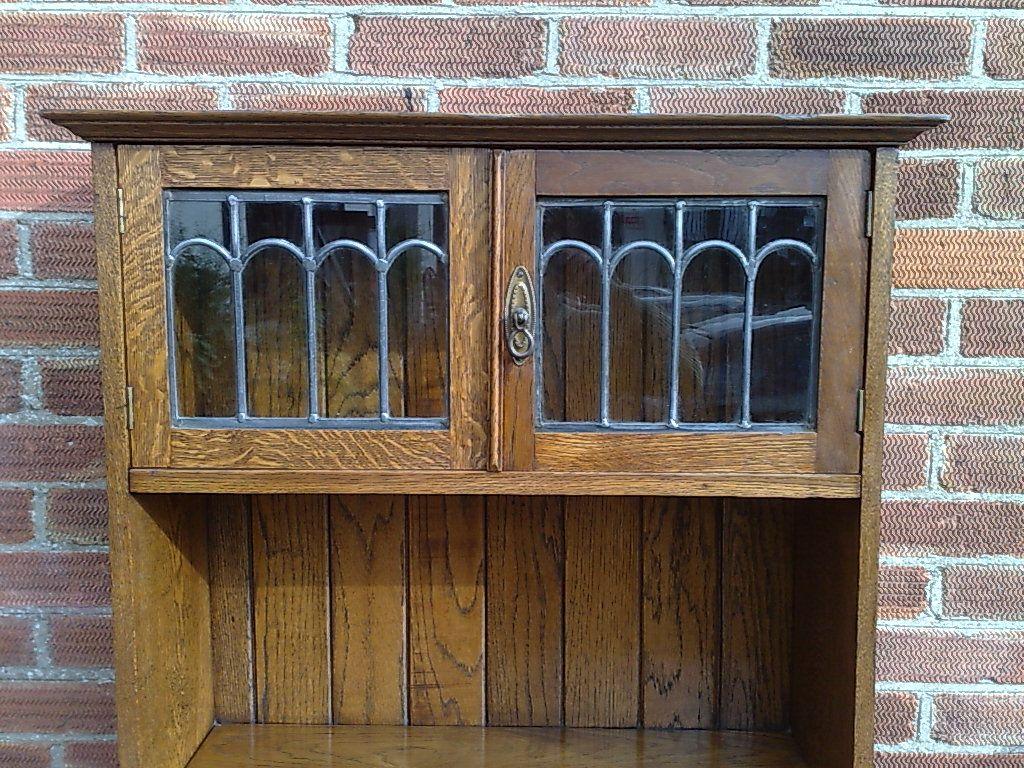 Early 20th Century An Arts and Crafts tall oak bureau bookcase with leaded glass doors For Sale