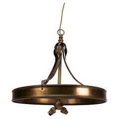 An Arts & Craft ceiling light with stylized petals & a circular brass ring