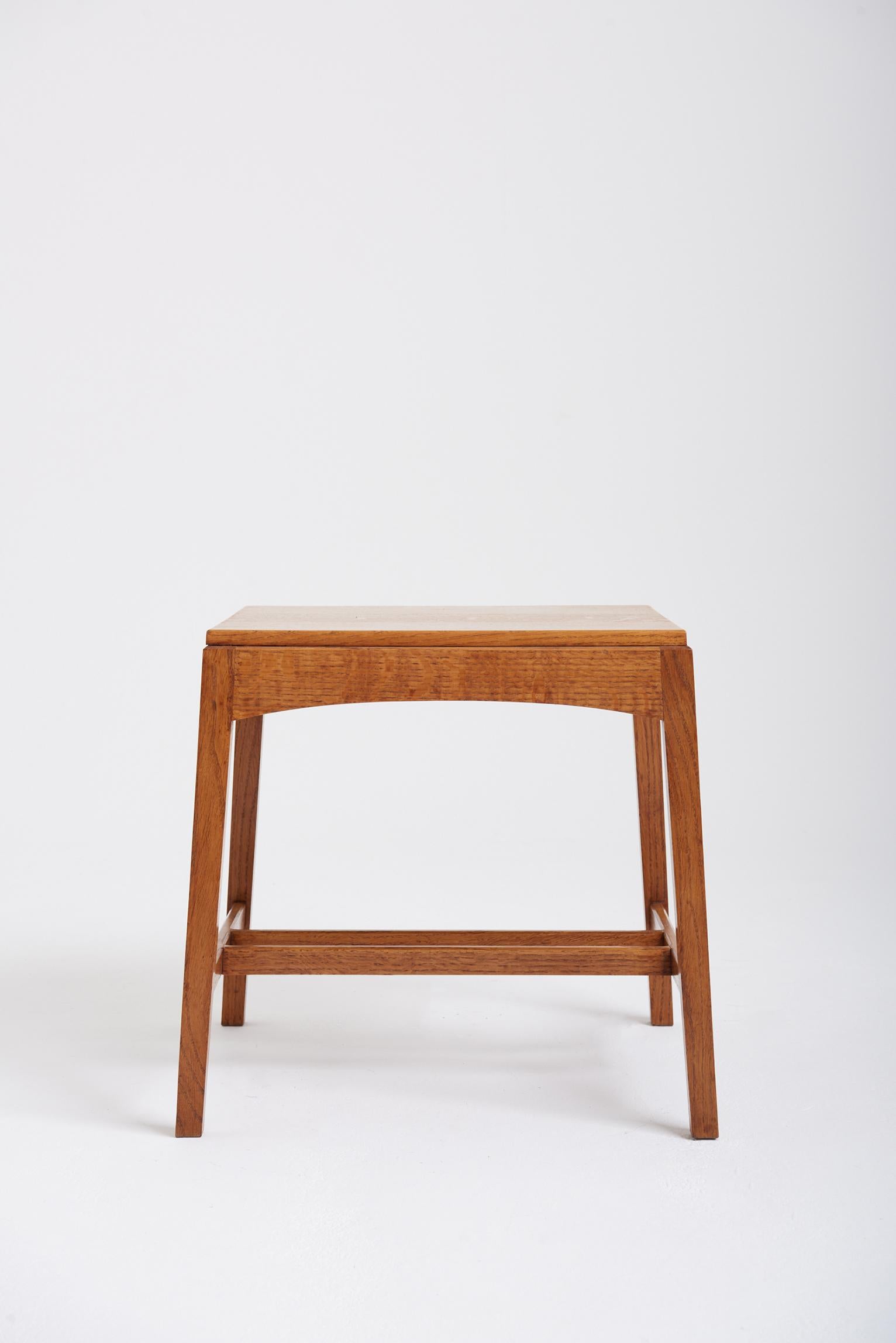 An Arts & Crafts movement oak side table.
England, circa 1920.