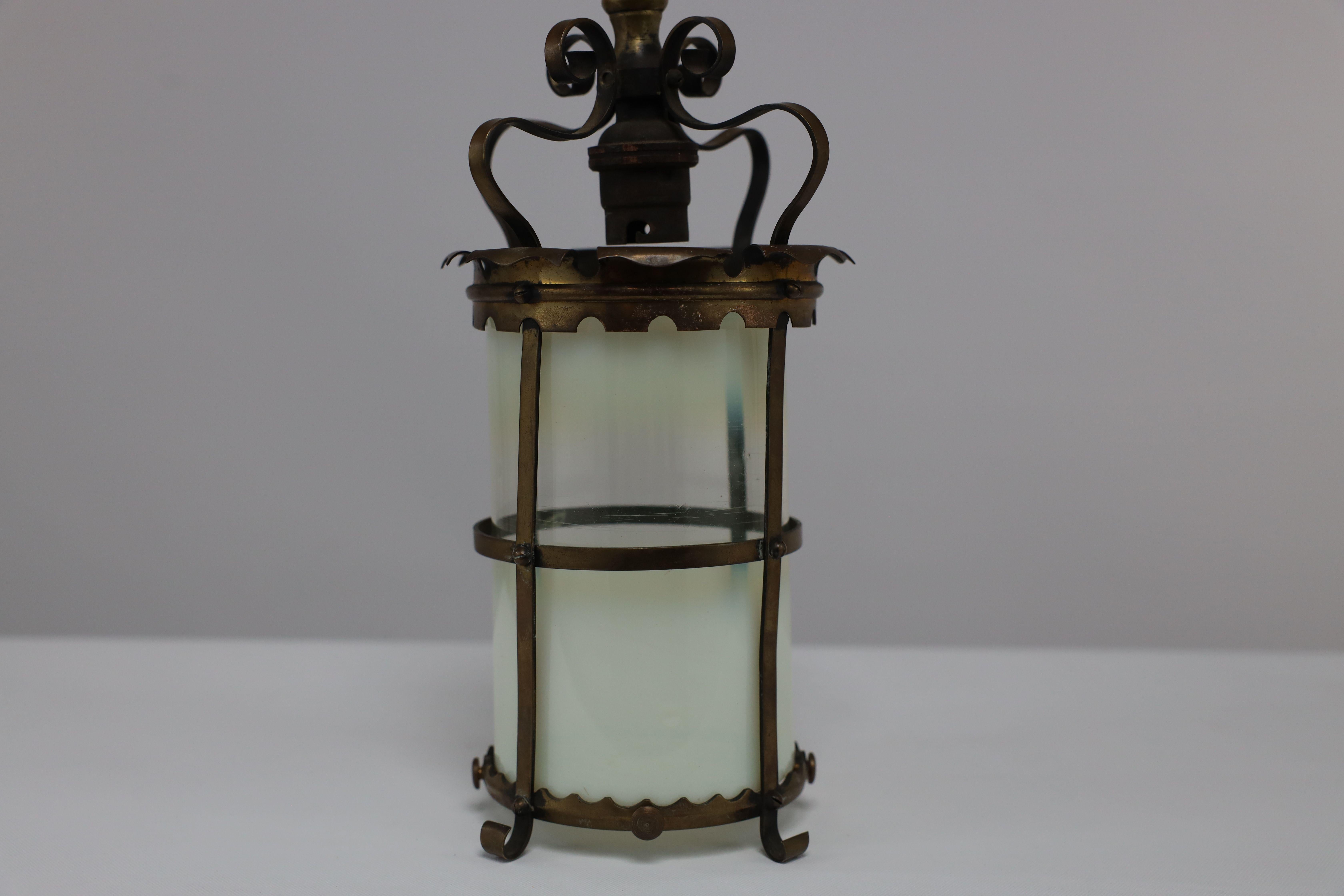 An Arts & Crafts brass ceiling lantern with the original vaseline shade 3