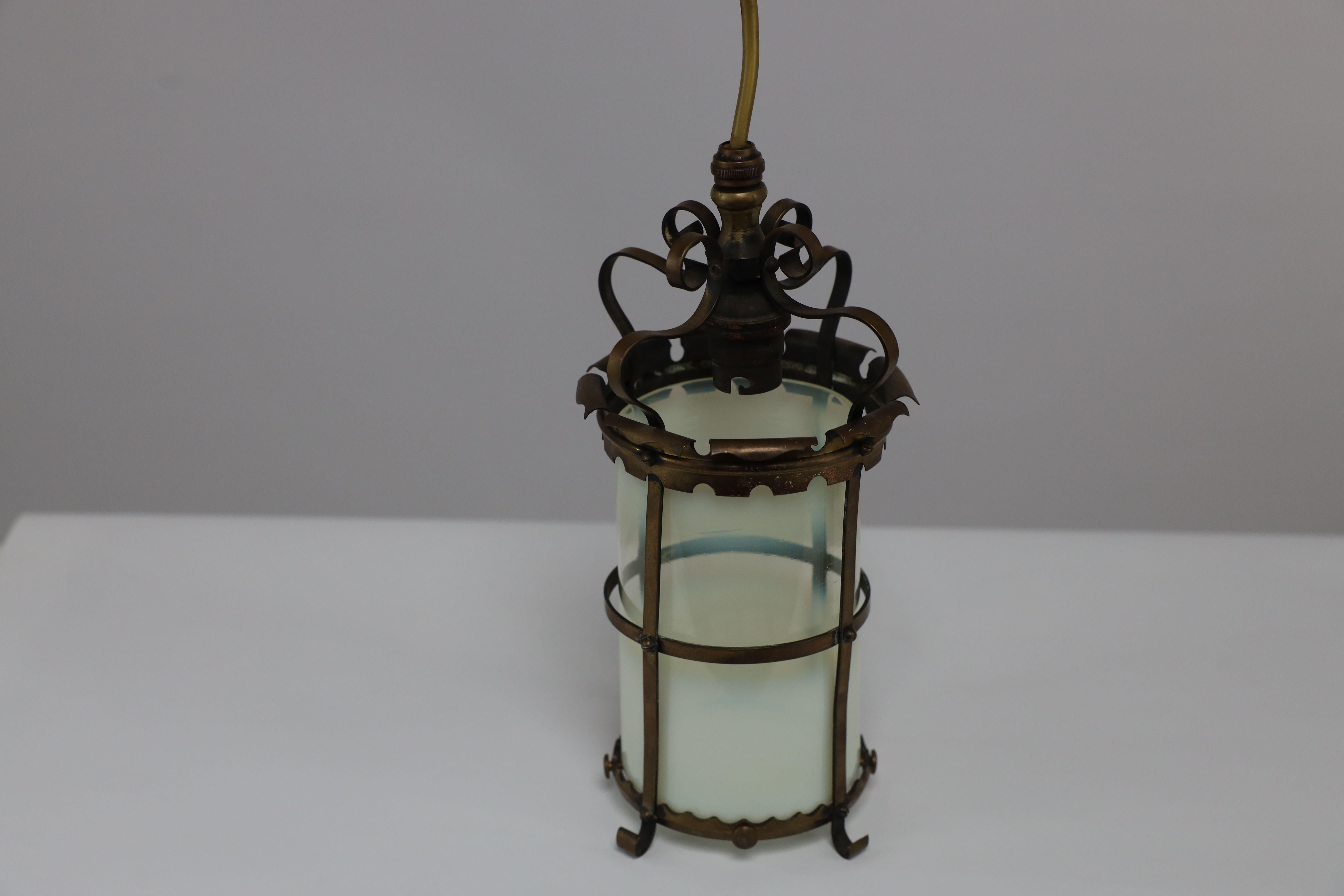 An Arts & Crafts brass ceiling lantern with the original vaseline shade 4