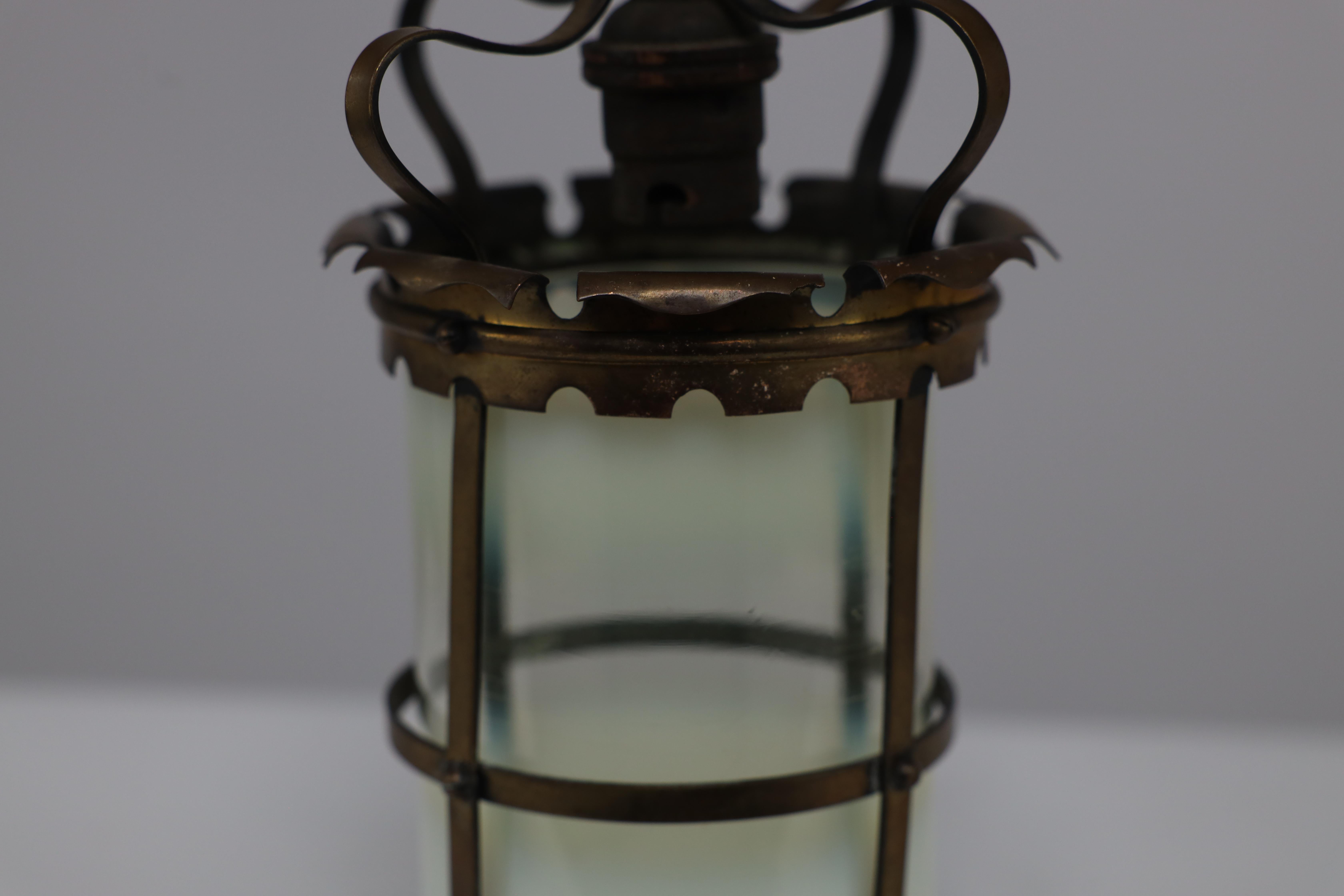 An Arts & Crafts brass ceiling lantern with the original vaseline shade 7