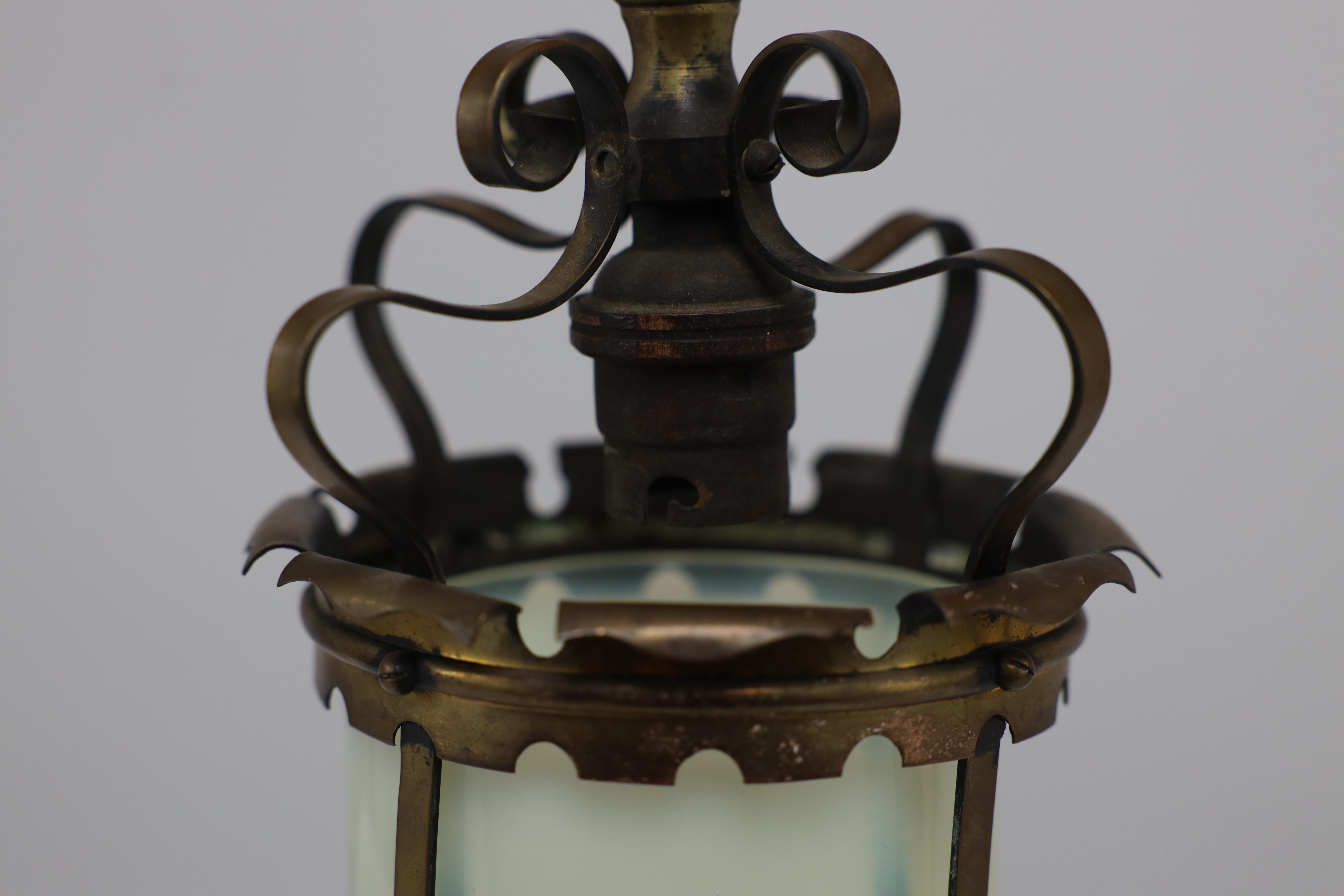 An Arts & Crafts brass ceiling lantern with the original vaseline shade 8