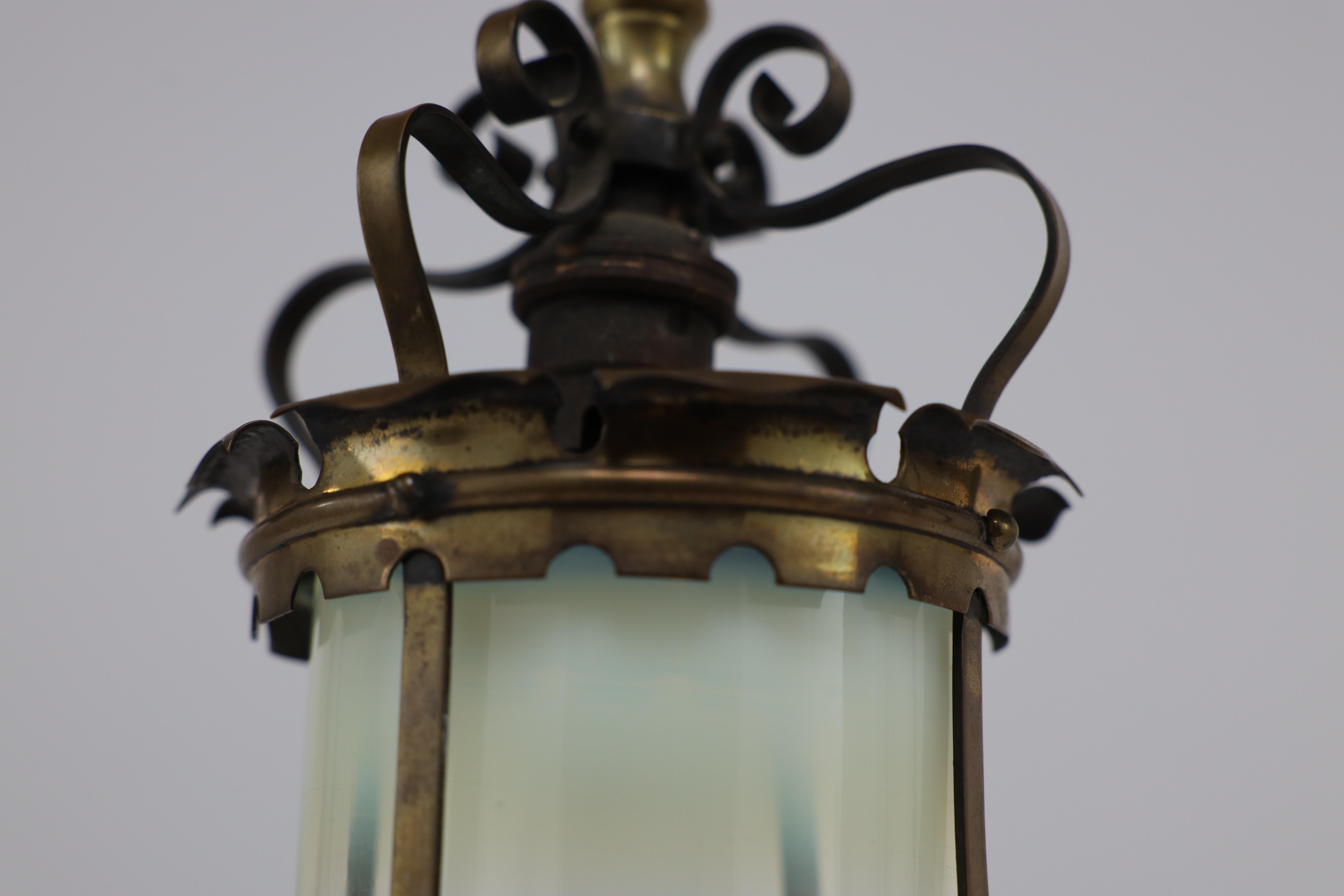 An Arts & Crafts brass ceiling lantern with the original vaseline shade 11