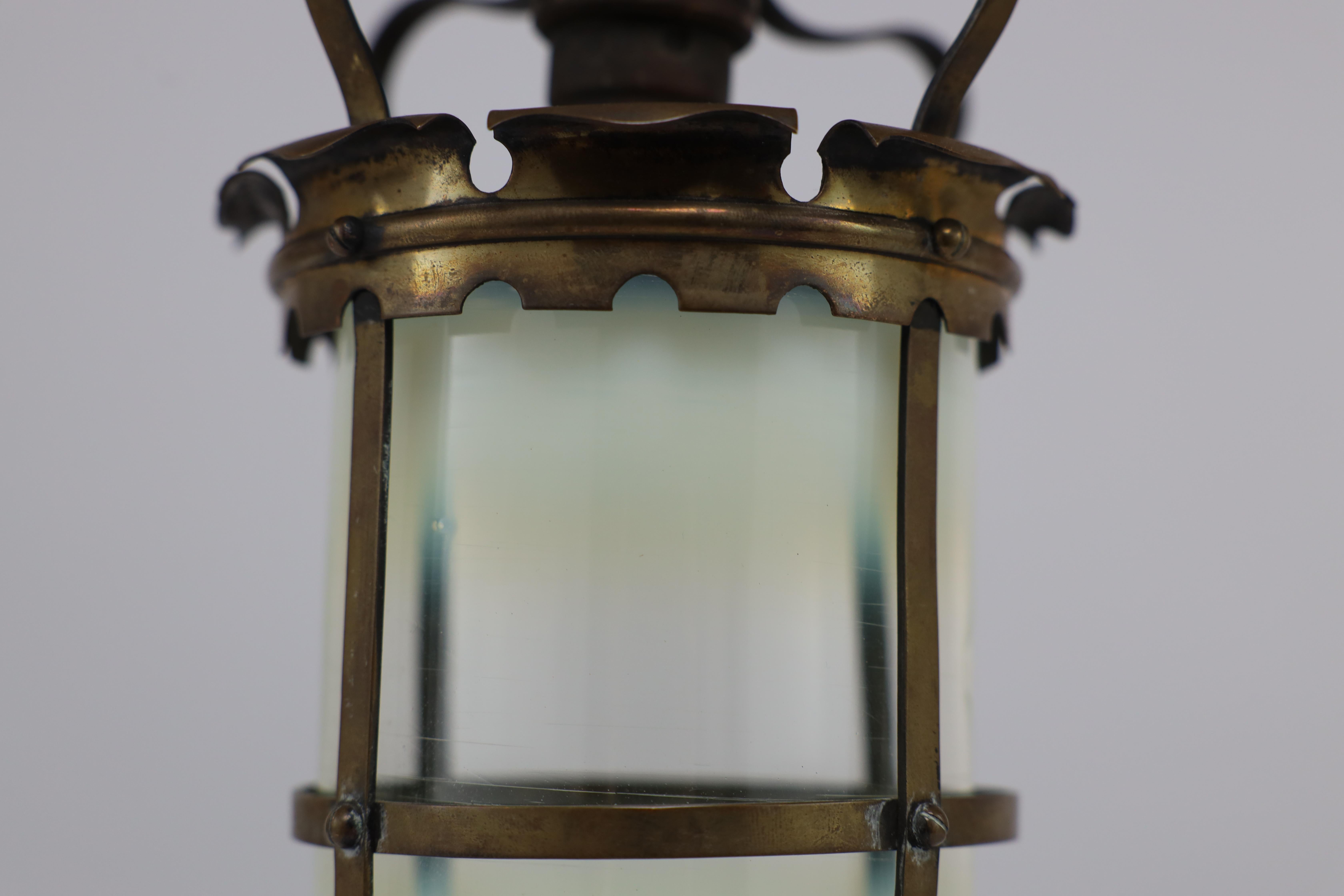 An Arts & Crafts brass ceiling lantern with the original vaseline shade 13