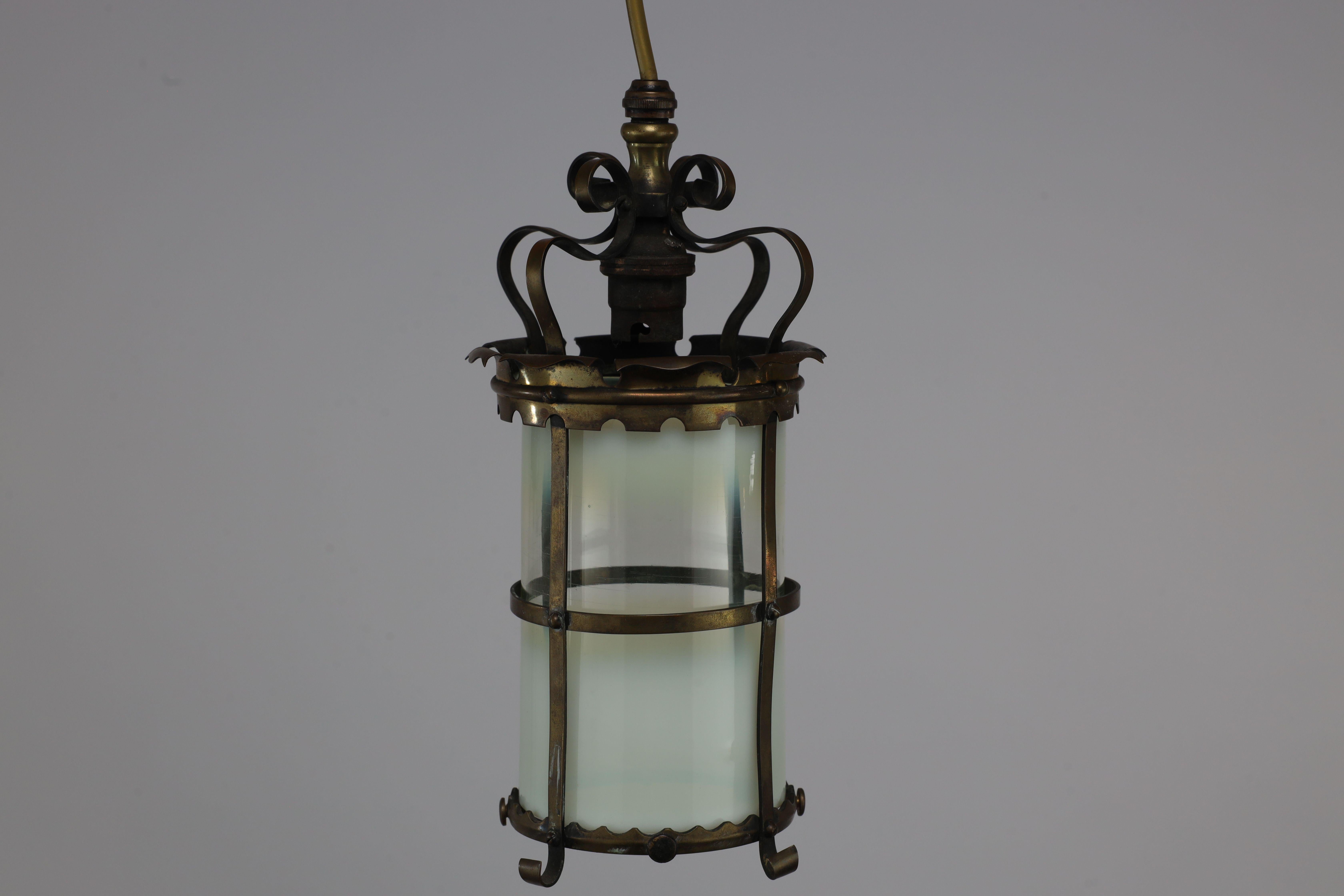 Early 20th Century An Arts & Crafts brass ceiling lantern with the original vaseline shade