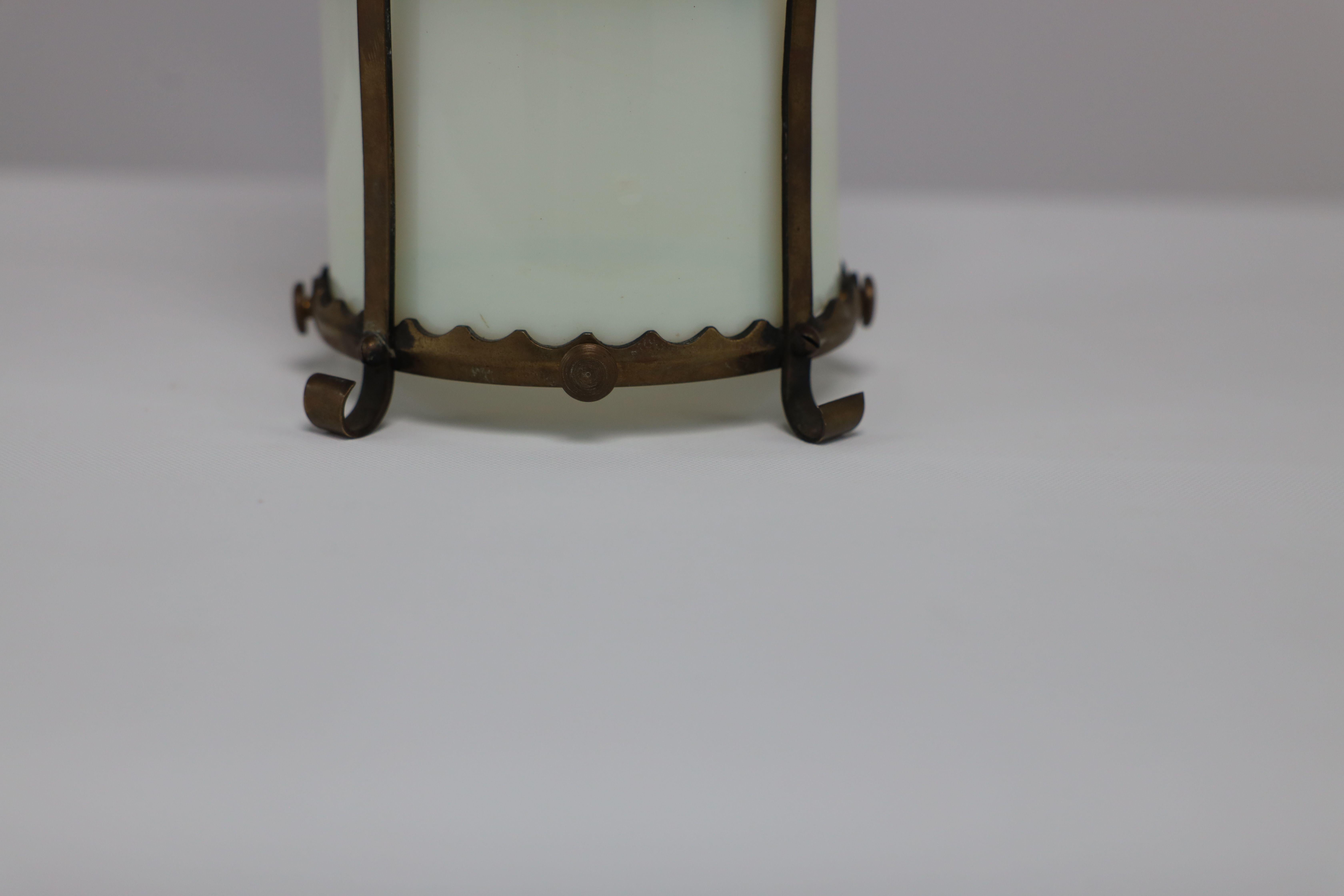 An Arts & Crafts brass ceiling lantern with the original vaseline shade 1