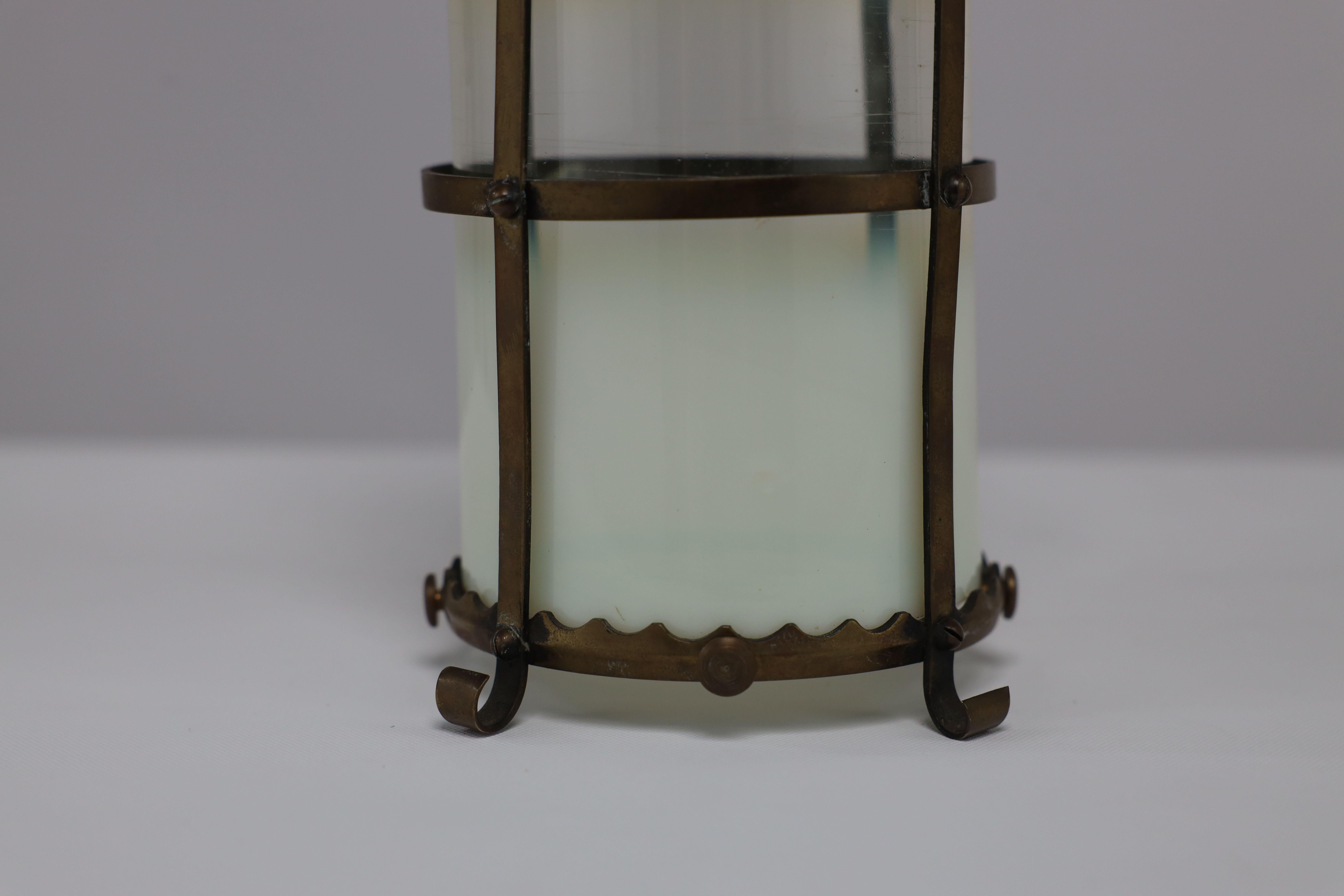 An Arts & Crafts brass ceiling lantern with the original vaseline shade 2