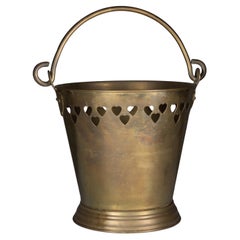 Antique An Arts & Crafts brass champagne bucket with pierced Voysey style heart decor