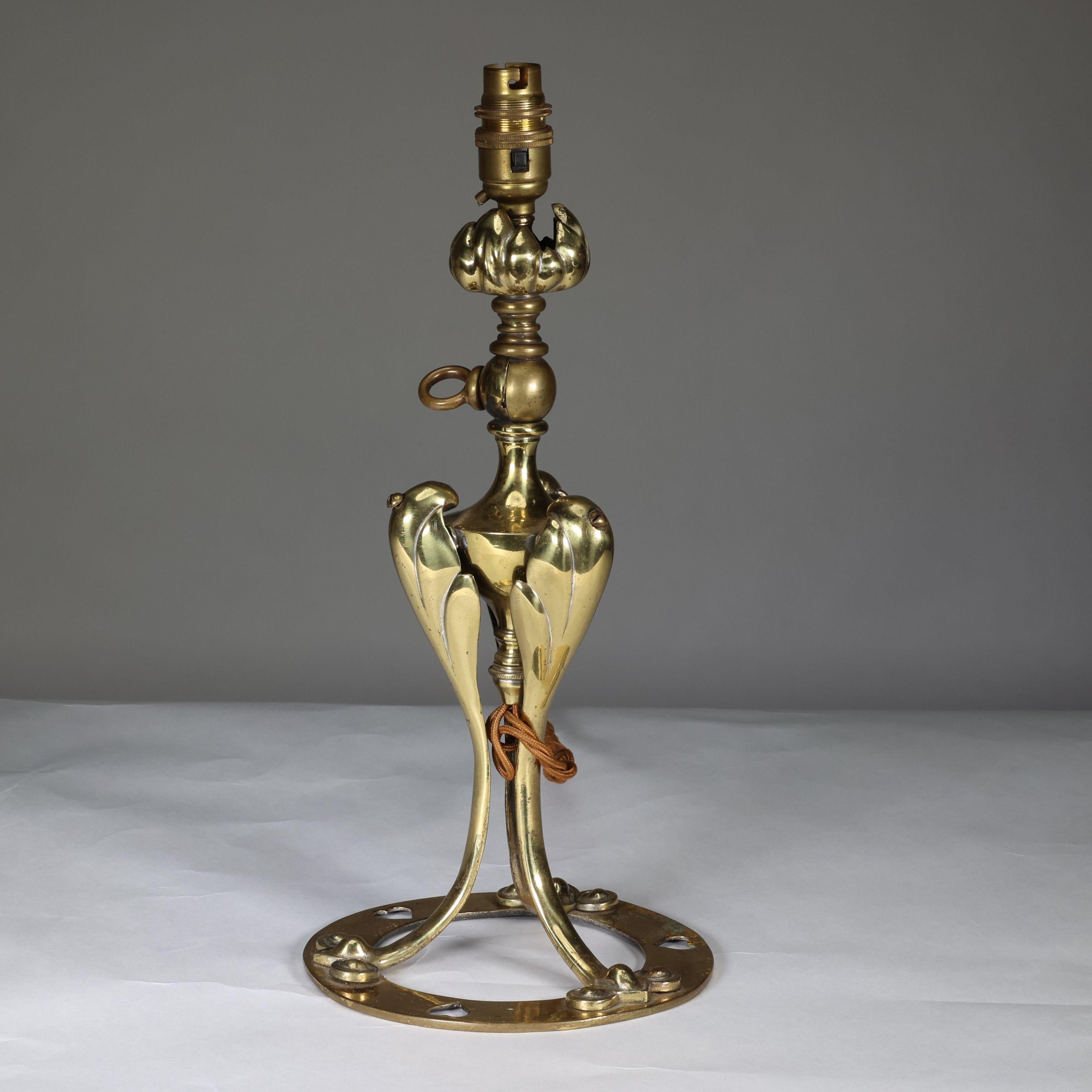 English An Arts & Crafts brass table lamp tulip shaped with heart cut-outs to the base For Sale
