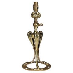 Antique An Arts & Crafts brass table lamp tulip shaped with heart cut-outs to the base