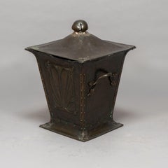 An Arts & Crafts copper conical Coal Bucket and Lid, with hand hammered sun rise